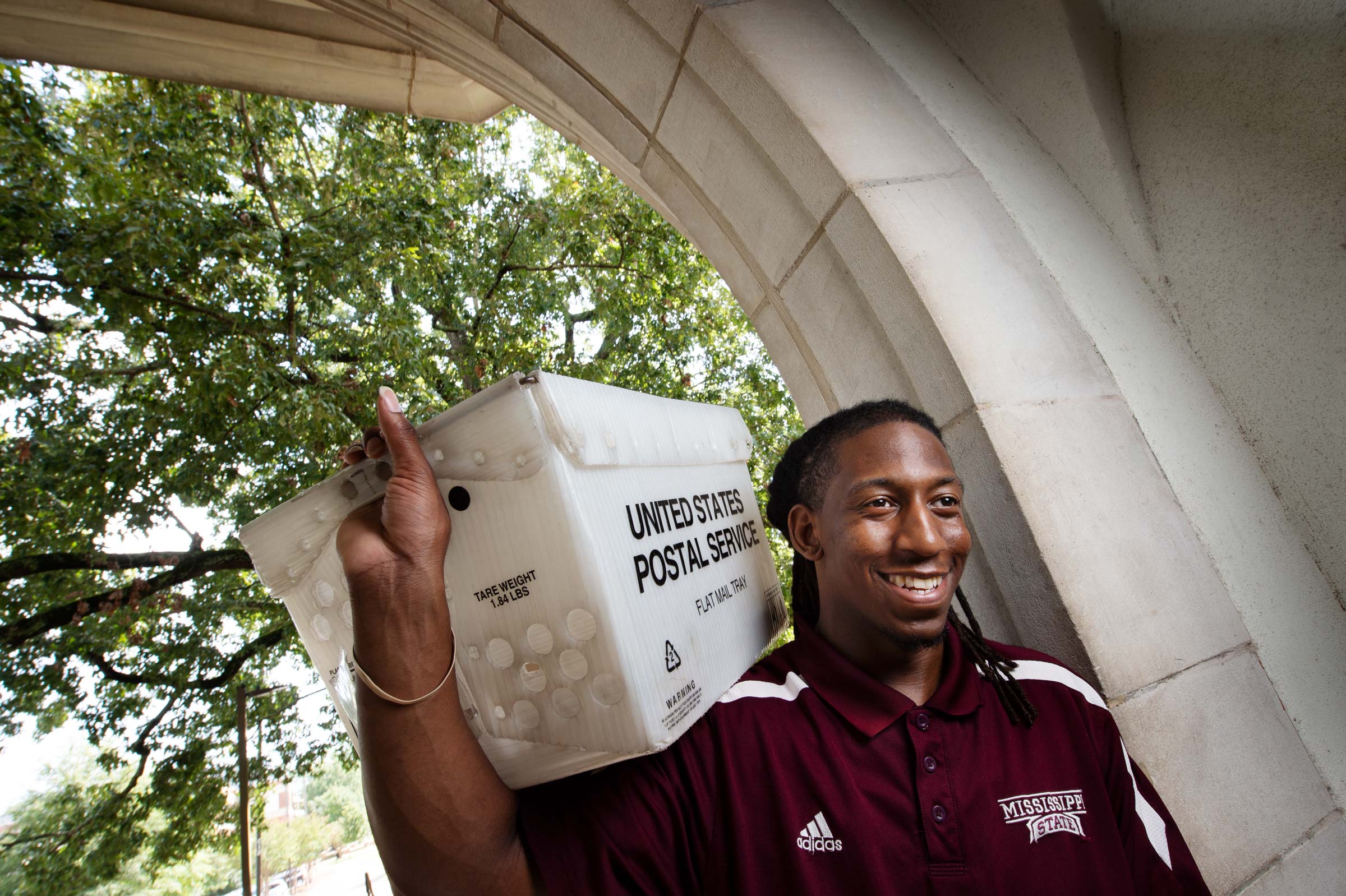J.R. Love, pictured carrying a mail container on the MSU campus.