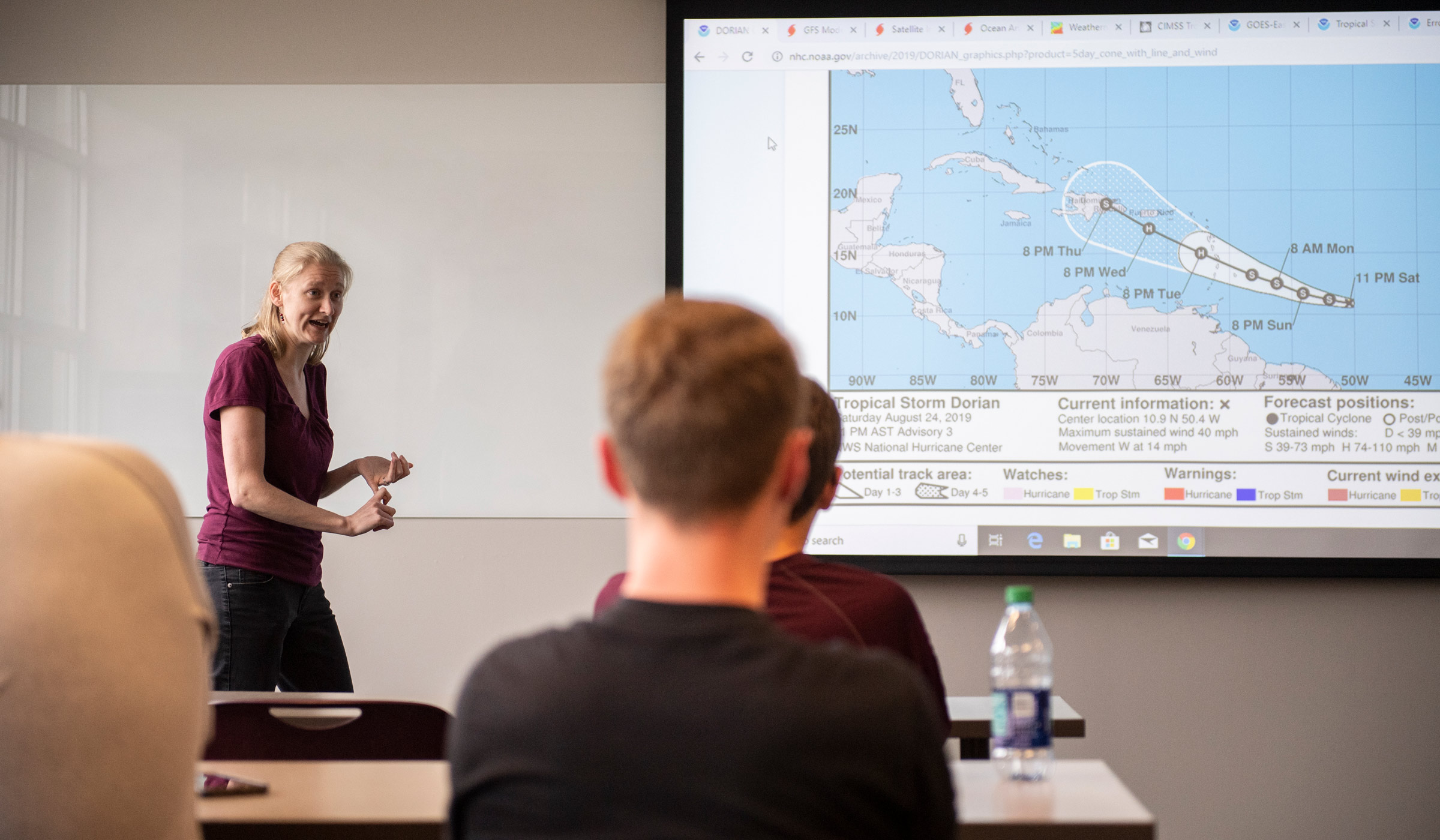 Kimberly Wood, assistant professor of geosciences and expert in tropical cyclones, briefs broadcast meteorology students on Tropical Storm Dorian.