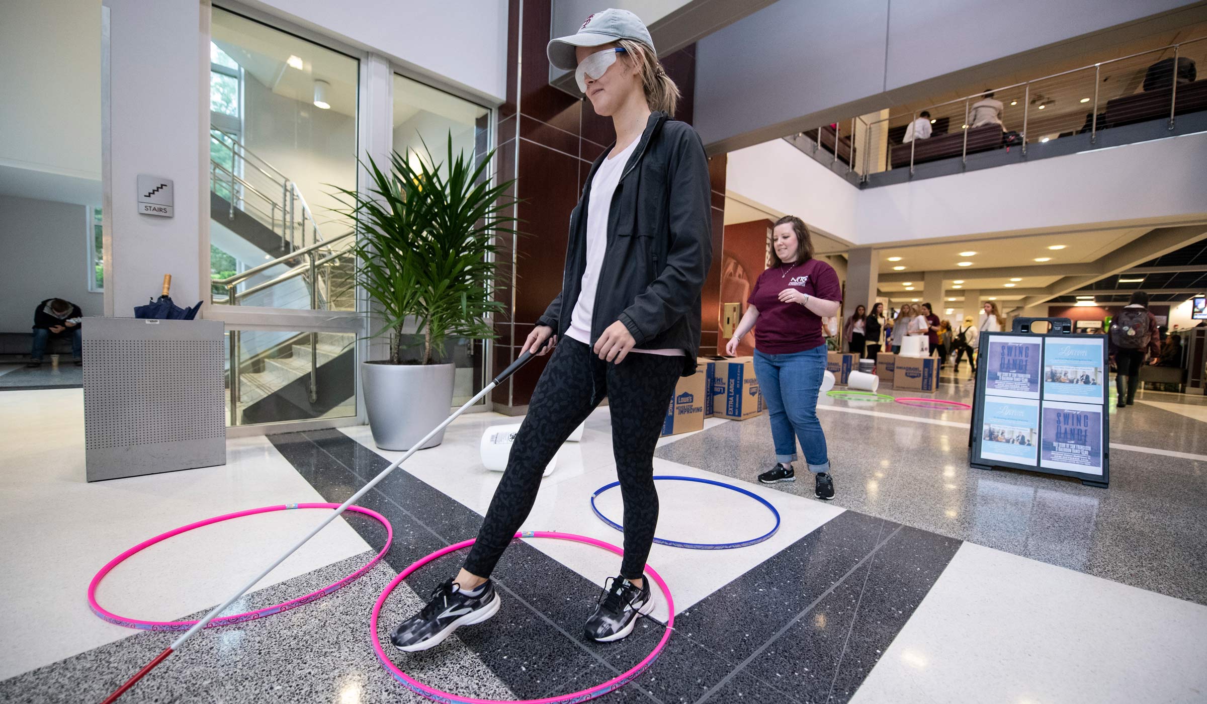 Junior Laura Isom participates in an obstacle course during white cane awareness day at the colvard student union.