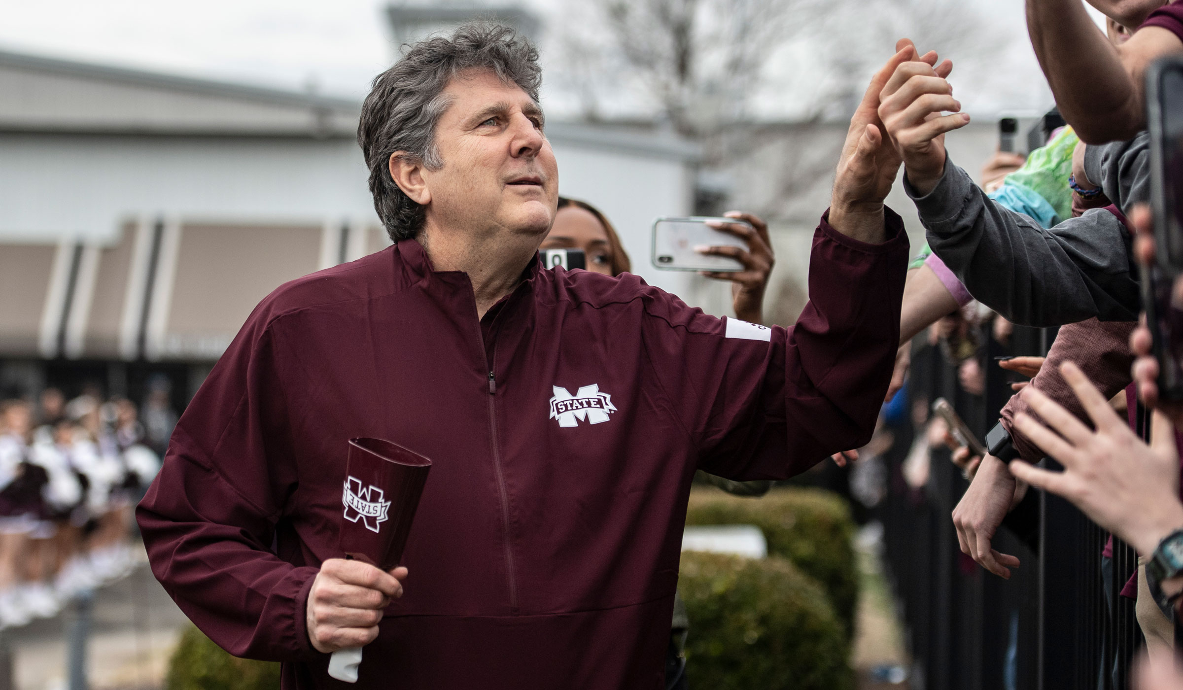 Newly announced MSU Football Head Coach Mike Leach Lands at the airport in Starkville and greets fans.
