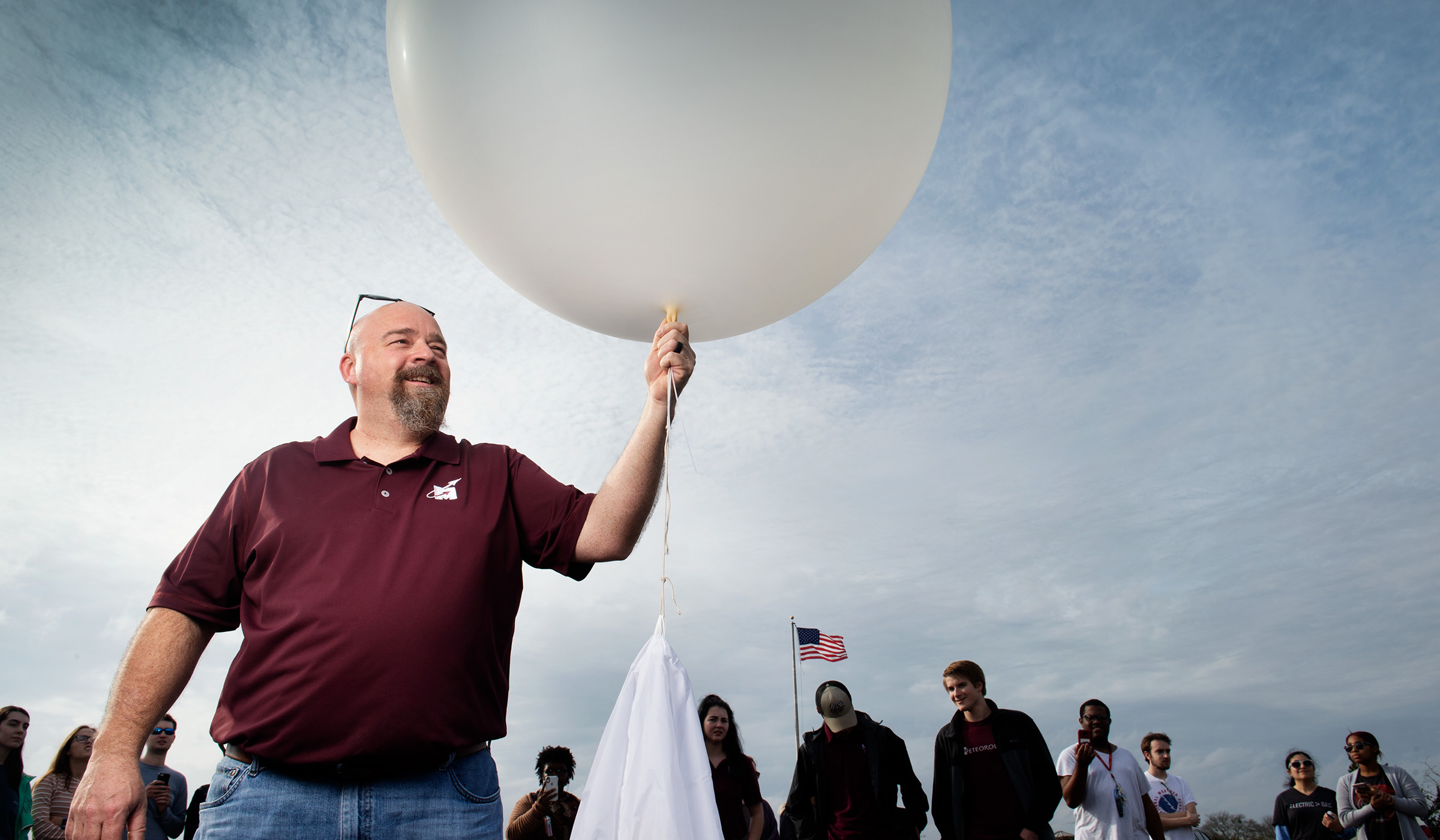 Mike Brown, pictured holding a weather balloon. 