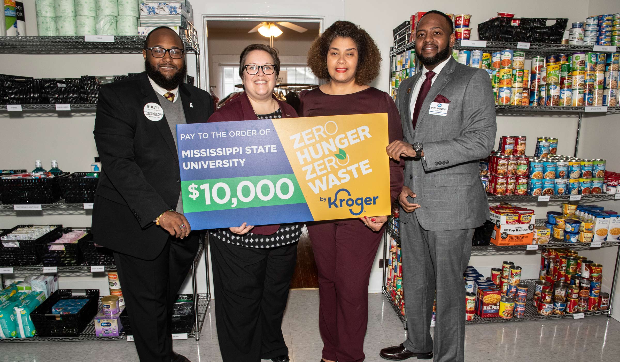 MSU and Kroger Representatives pose with a check donation to Bully&#039;s Closet.