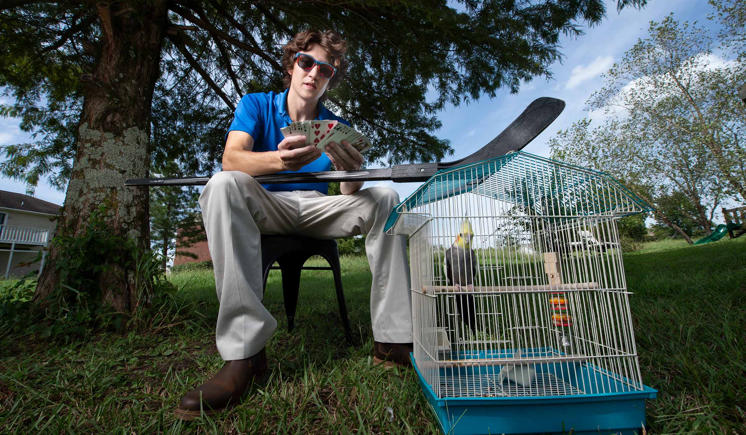Sean Moskal, pictured outside with his pet bird.