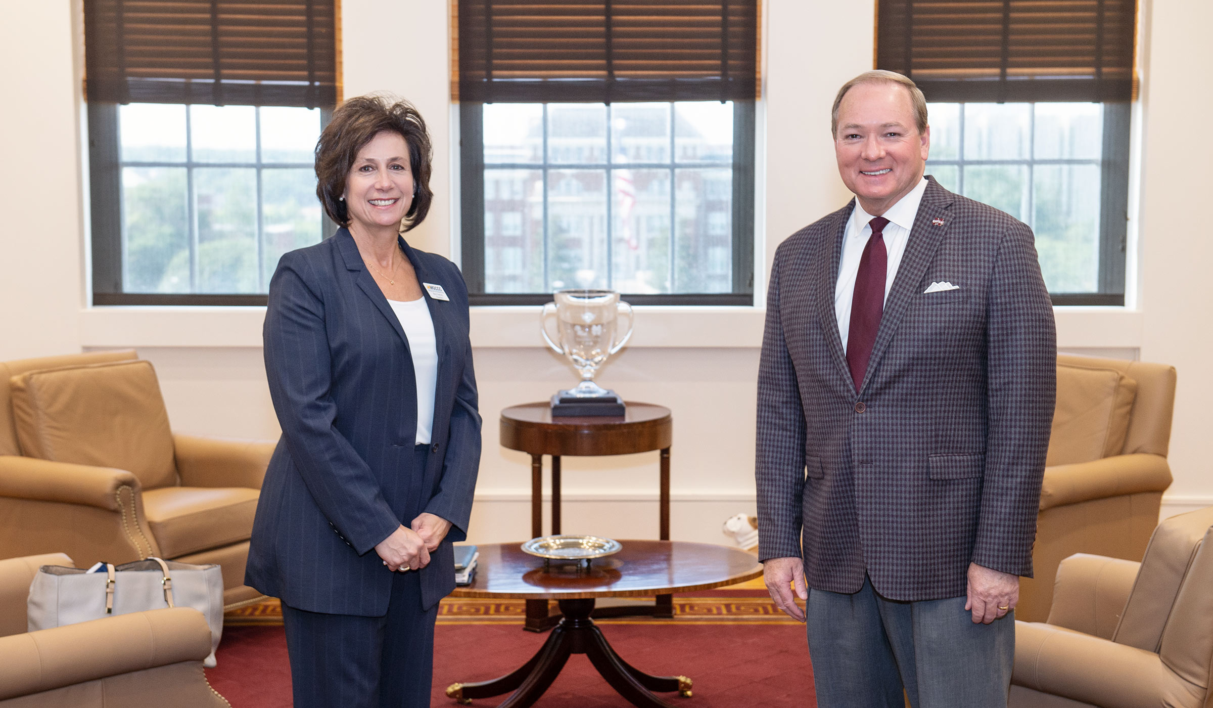 Mary Graham, president of Mississippi Gulf Coast Community College, poses for a photo with President Keenum in the Presidential Suite.