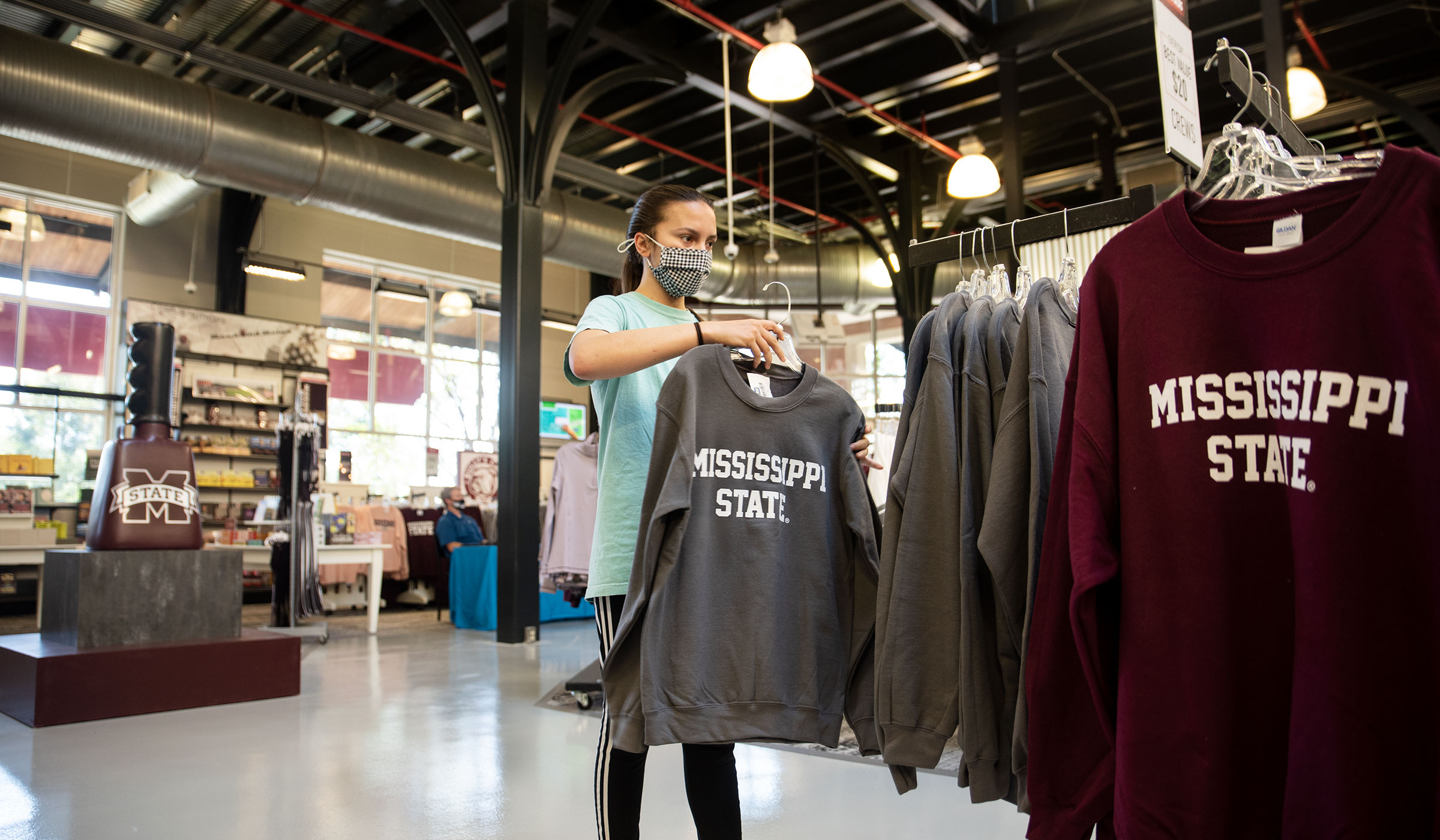 Student McKenna Jacobs broses through Mississippi State sweatshirts at the recently remodelled Barnes &amp; Noble.