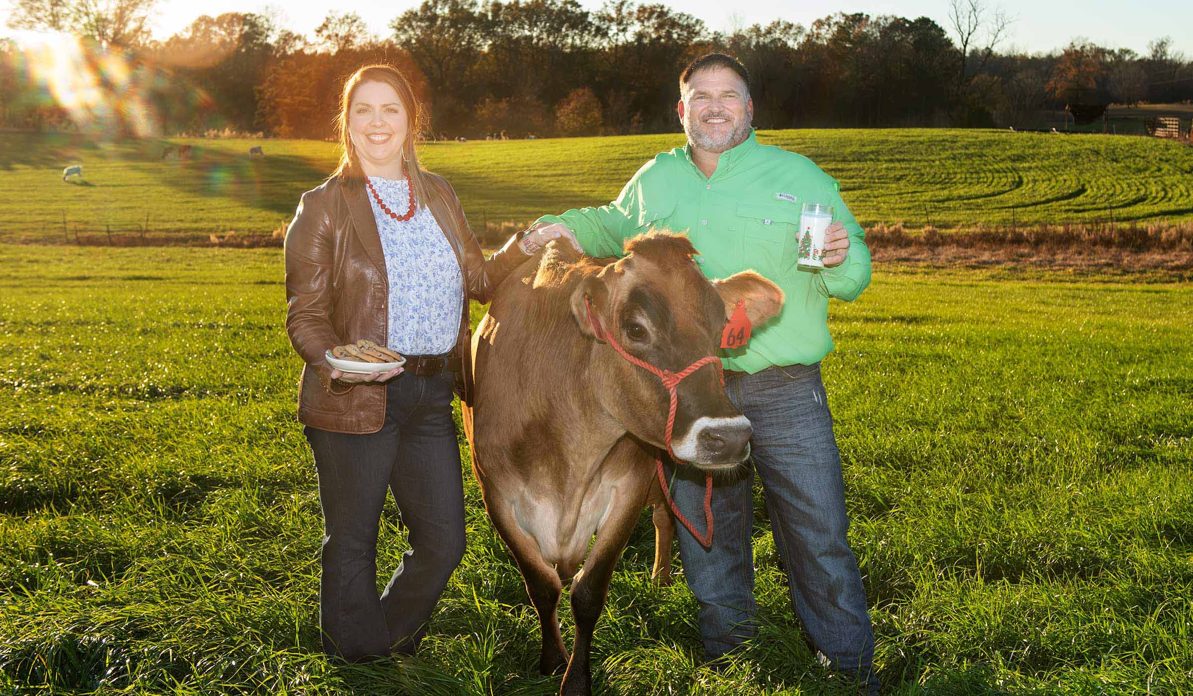 Kenneth and Jessica Graves, pictured with a cow on MSU&#039;s South Farm.