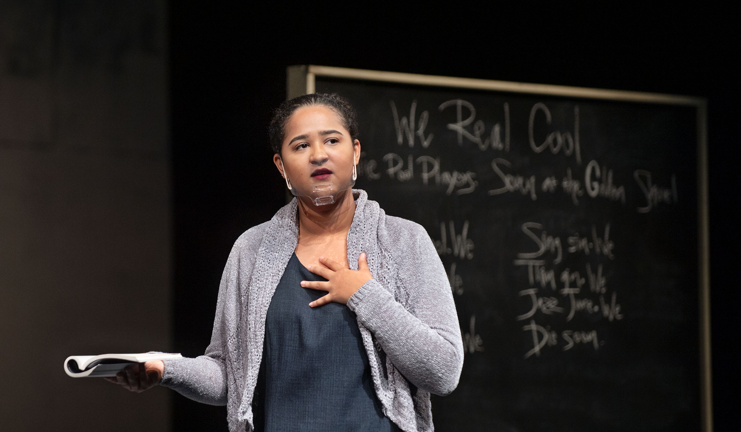 Theatre MSU student actress Preslie Cowley plays the lead character, Nye, teaching in front of a blackboard in the play &quot;Pipeline.&quot;