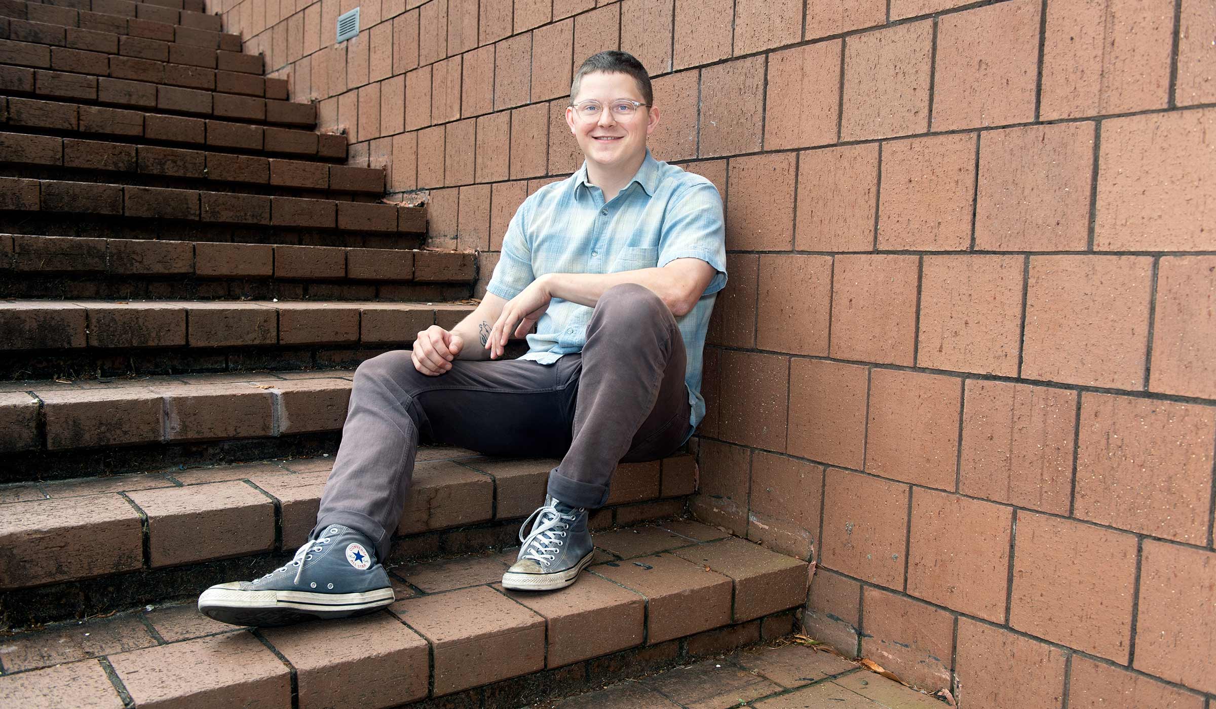 Luke Murray, pictured on the steps of Giles Hall
