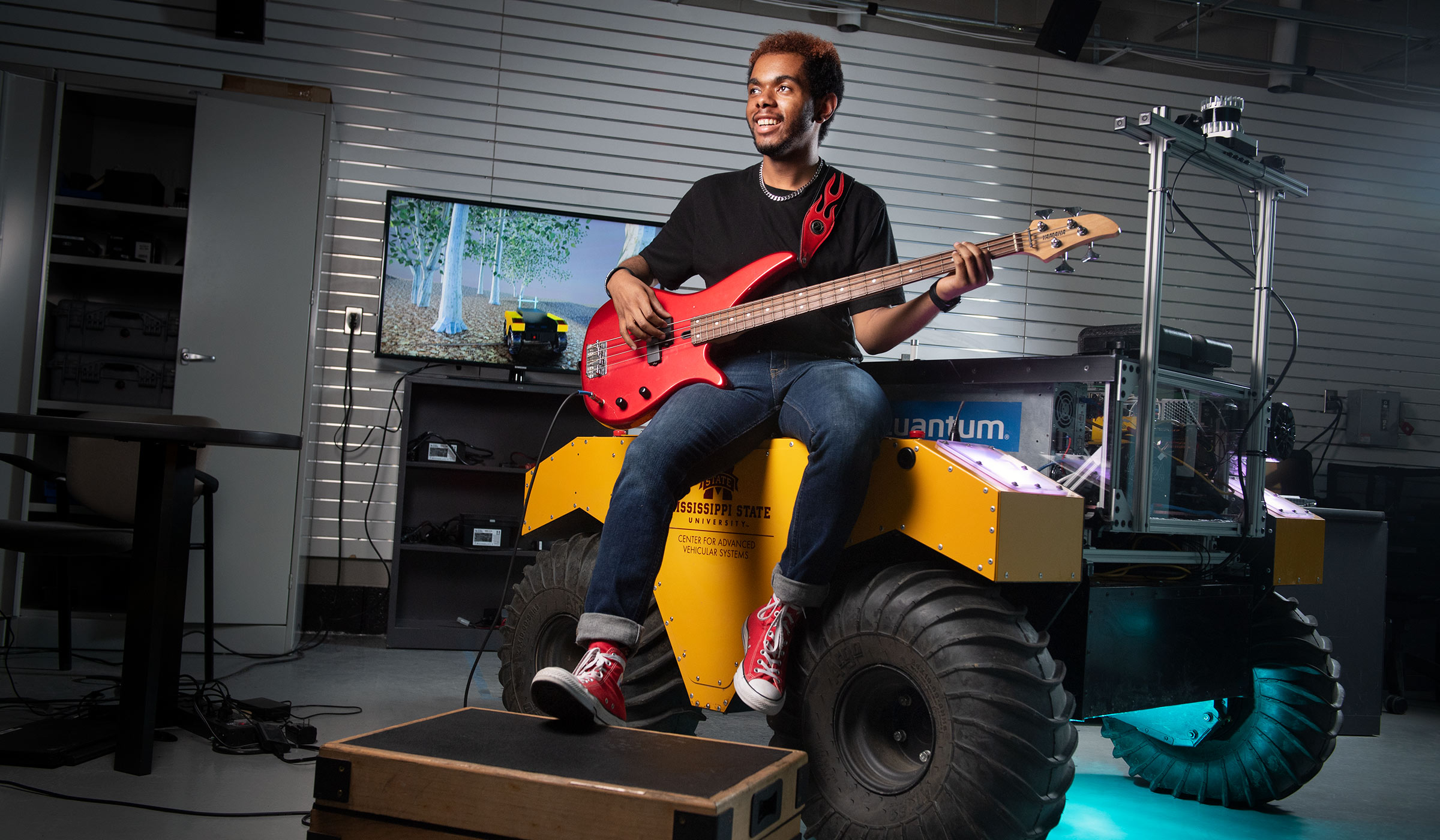 Warren Wheeler, pictured playing the bass on top of an autonomous offroad vehicle