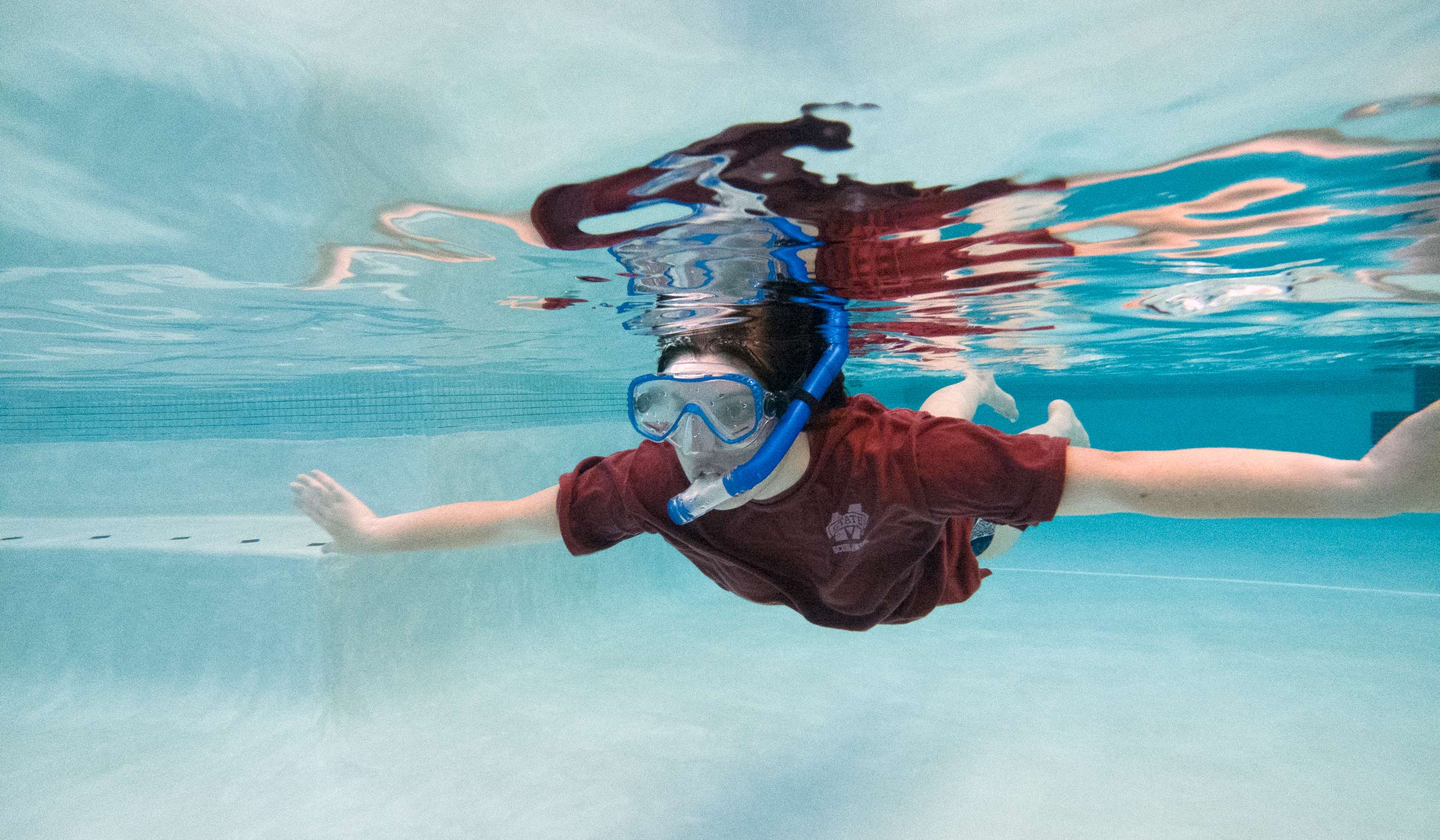 Katherine Walgamotte, pictured using a snorkle in the Sanderson Center pool.