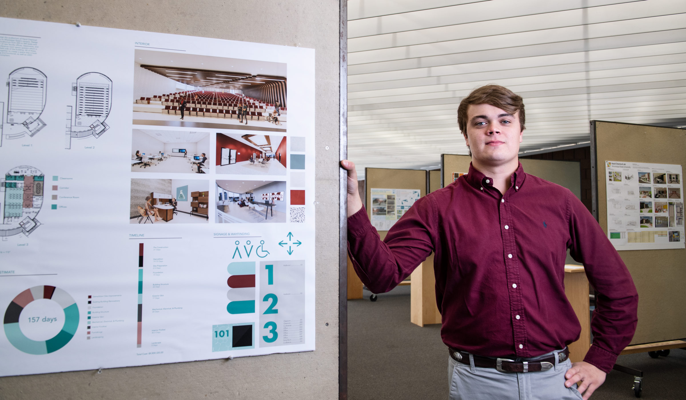 Philip Christian, pictured in front of his team&#039;s design poster.