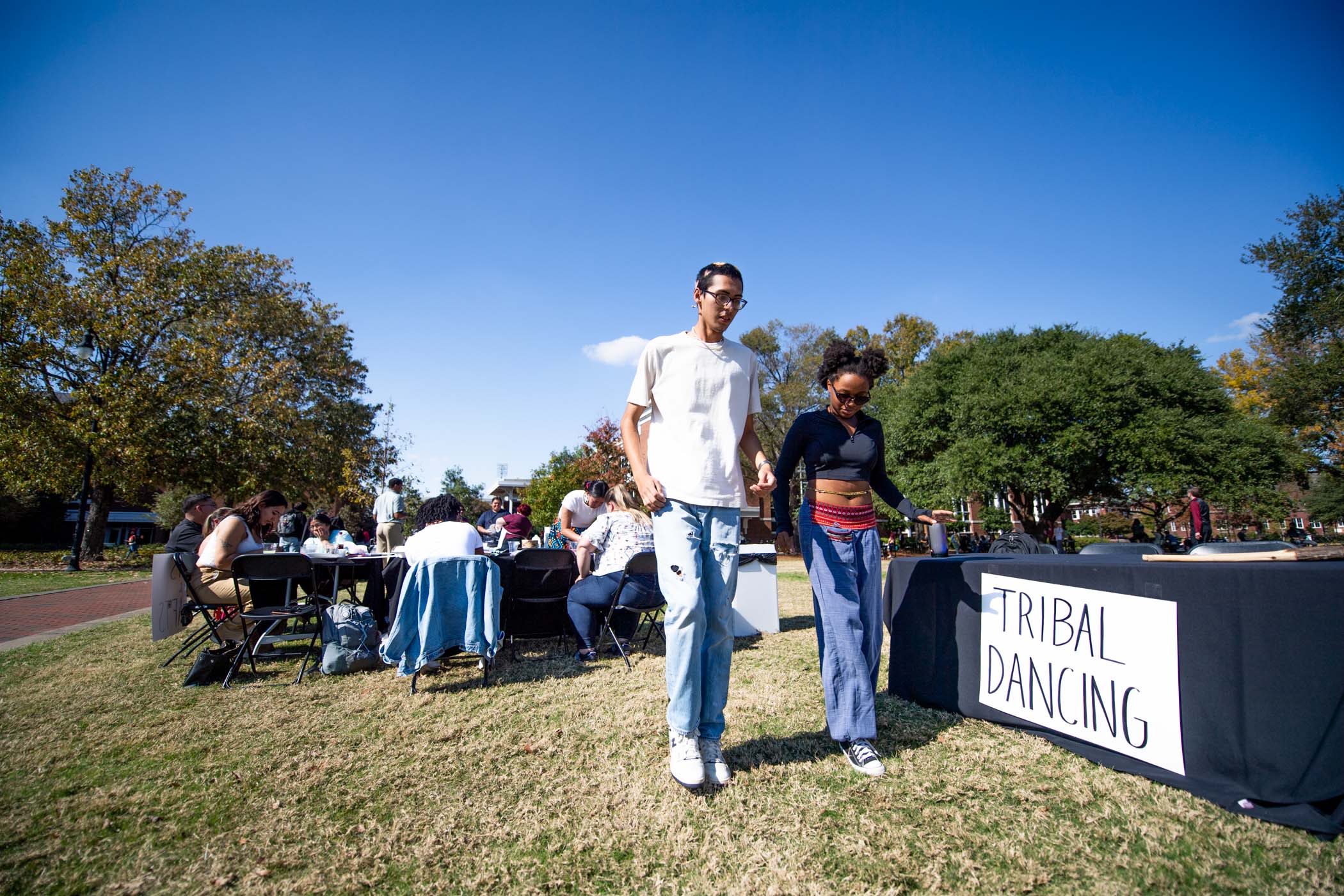 Students step together in a traditional tribal dance led by members of MSU ADI