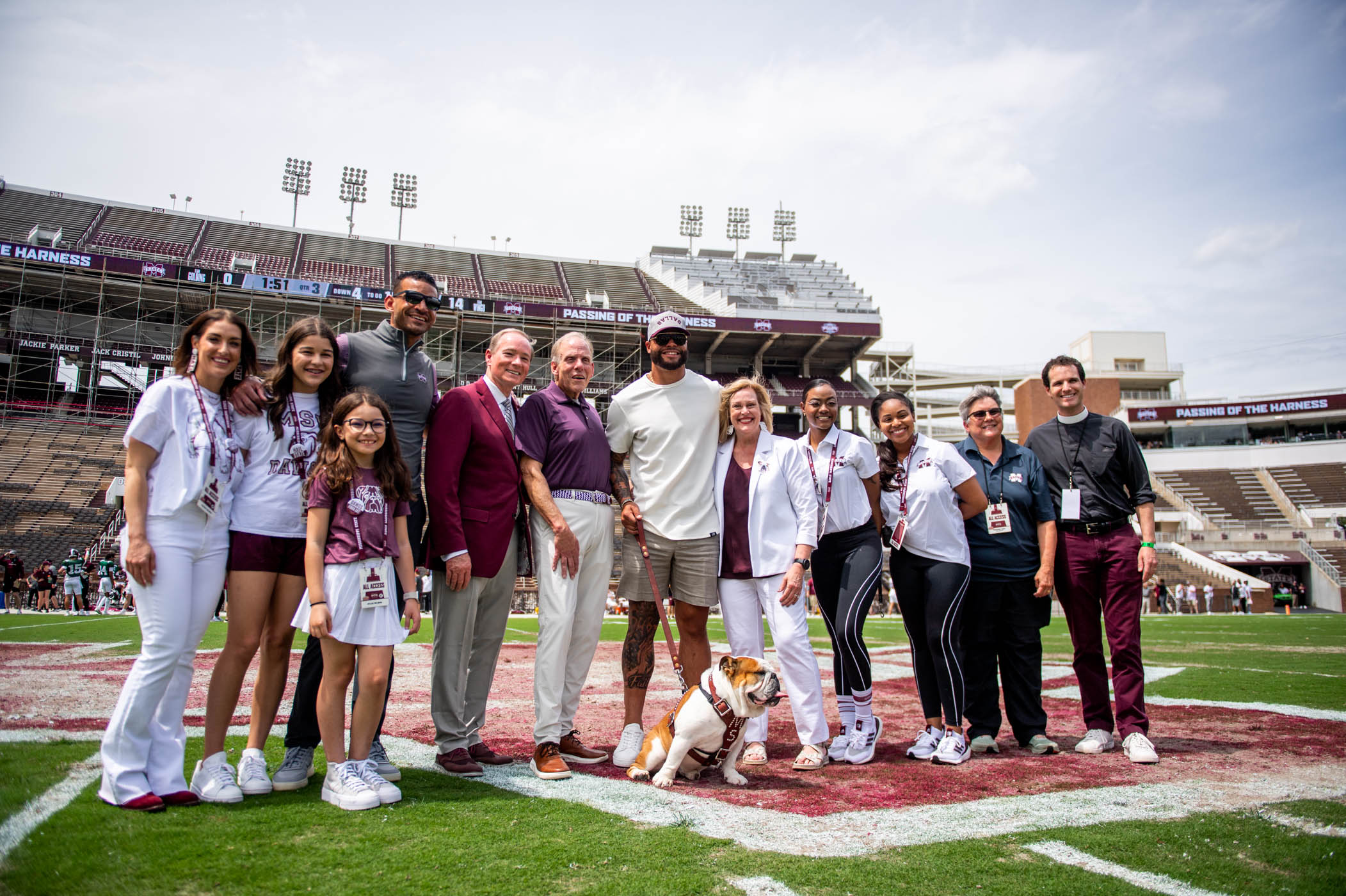 Family and friends of MSU&#039;s newest live Bully, Dak, gather together for a group photo on the field of Davis Wade Stadium.