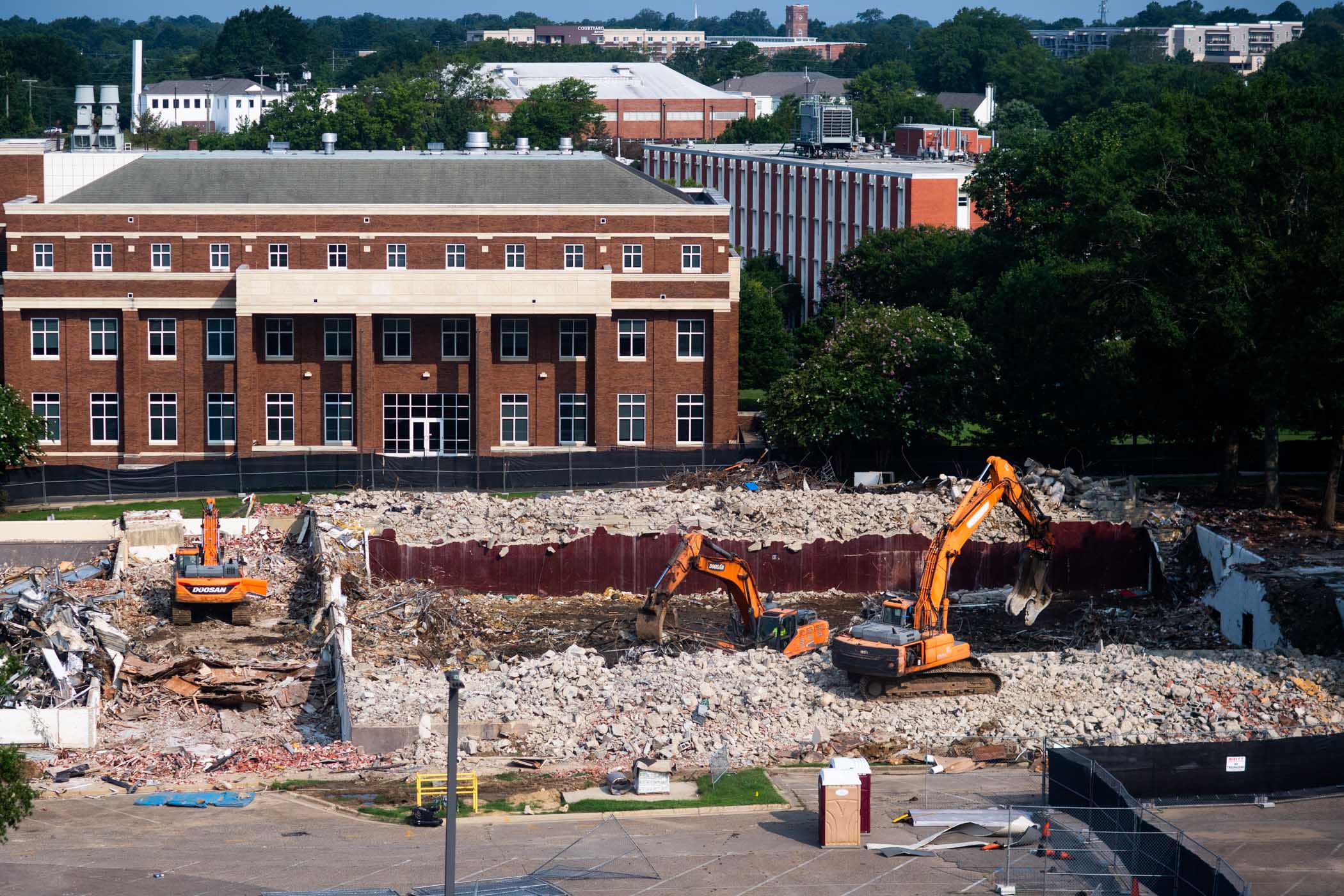 Looking down on the site of the former McCarthy Gym, with views to the Ag &amp; Bio Building, Dorman Hall, and all the way to the Mill&#039;s tower.  Massive orange excavators work to remove the remnants of McCarthy Gym in the foreground.