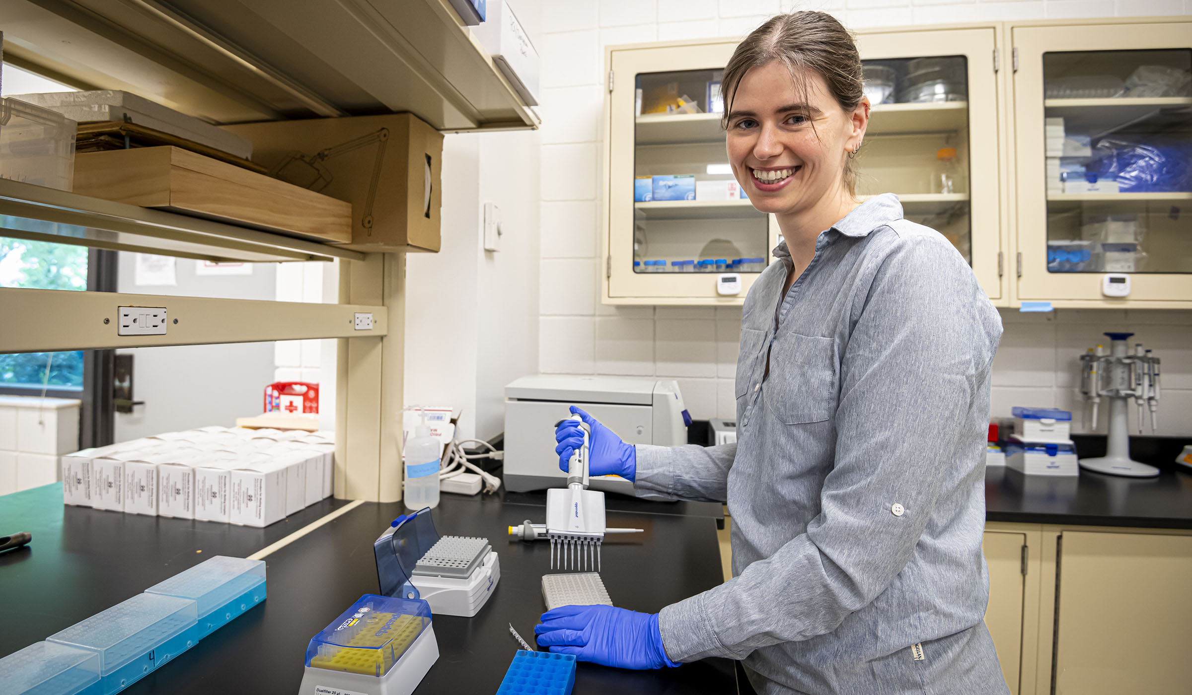 Lacy Dolan is pictured working in a lab.