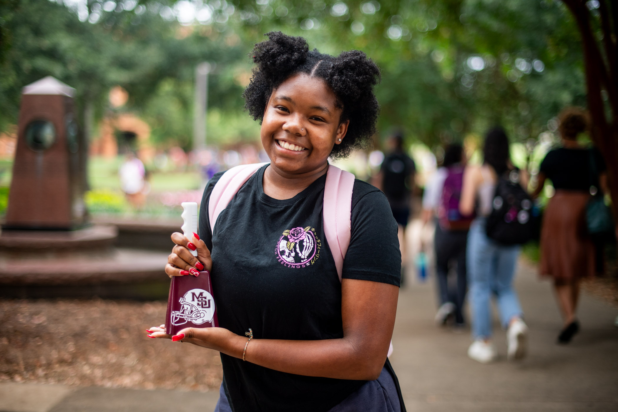 Journi Hunter, a sophomore animal and dairy sciences major from Covington, Georgia, displays her new cowbell, courtesy of the Mississippi State Office of Public Affairs&#039; First Day of Classes Giveaway.