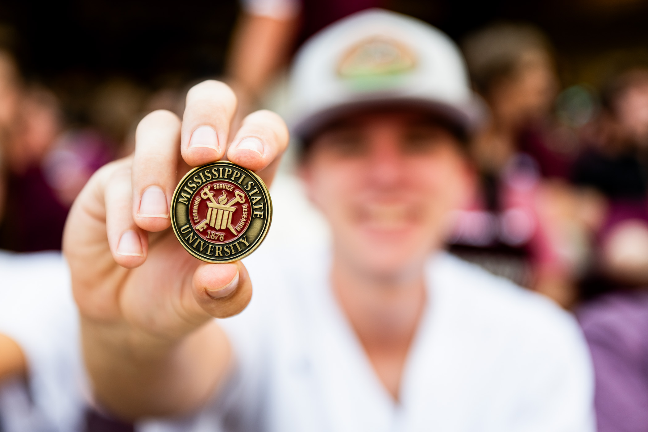 Mississippi State University welcomes its largest-ever freshman class, as well as new transfer students, to campus with fall convocation, marking the beginning of their academic journey at MSU. Students are presented with a commemorative coin, a special traditional keepsake to hold onto from the beginning to the end of their undergraduate chapter at MSU. 