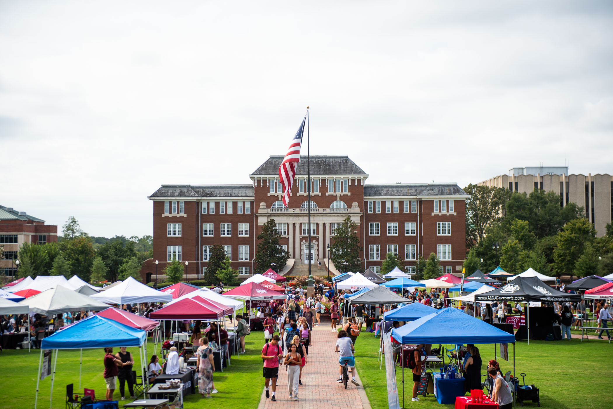 Students crossing the Drill Field explore options to get involved on campus and in the community at MSU&#039;s &quot;Shades of Starkville.&quot; 