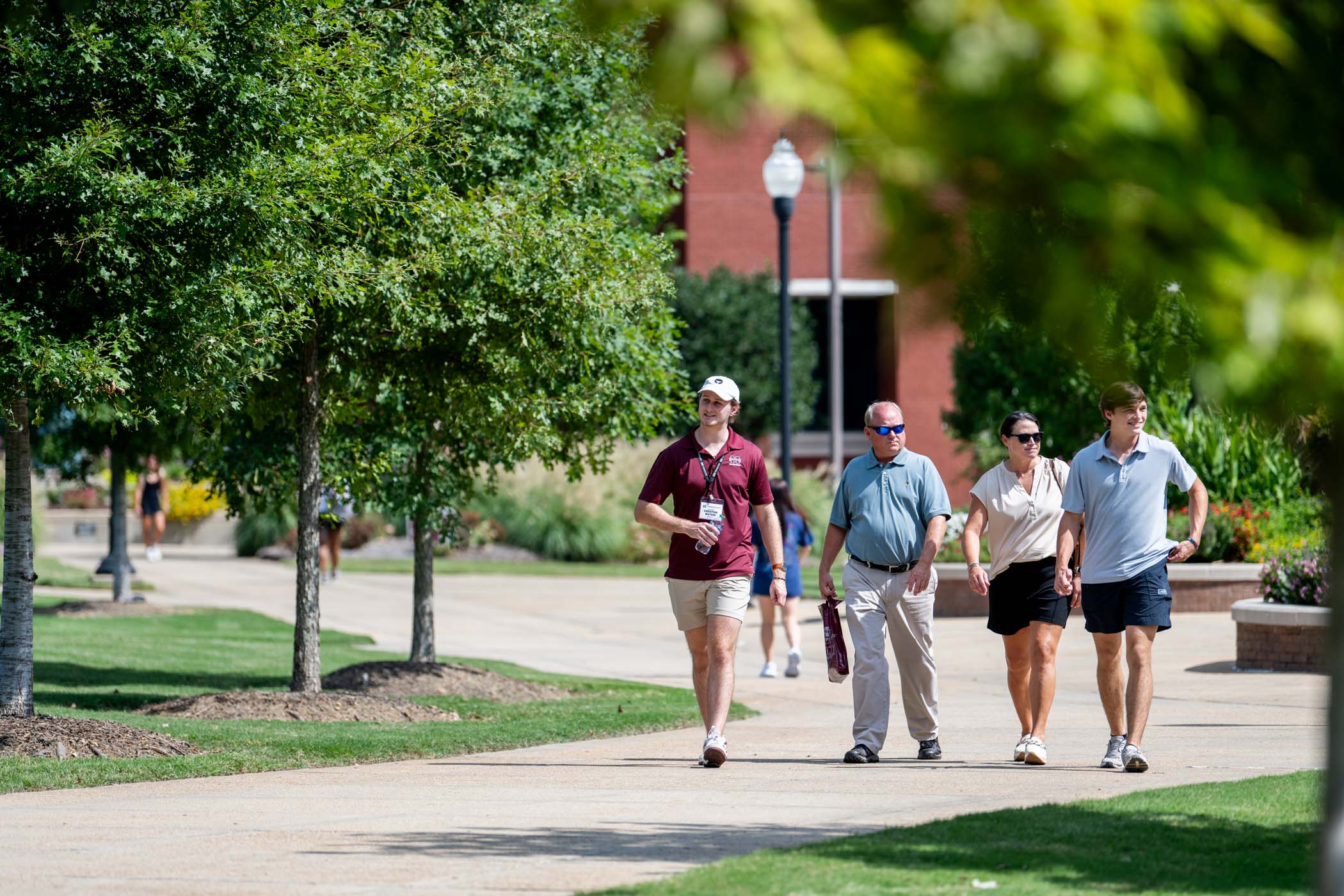 Christian Watson, an MSU roadrunner and senior electrical engineering student from Madison, leads a guided group tour, across campus.