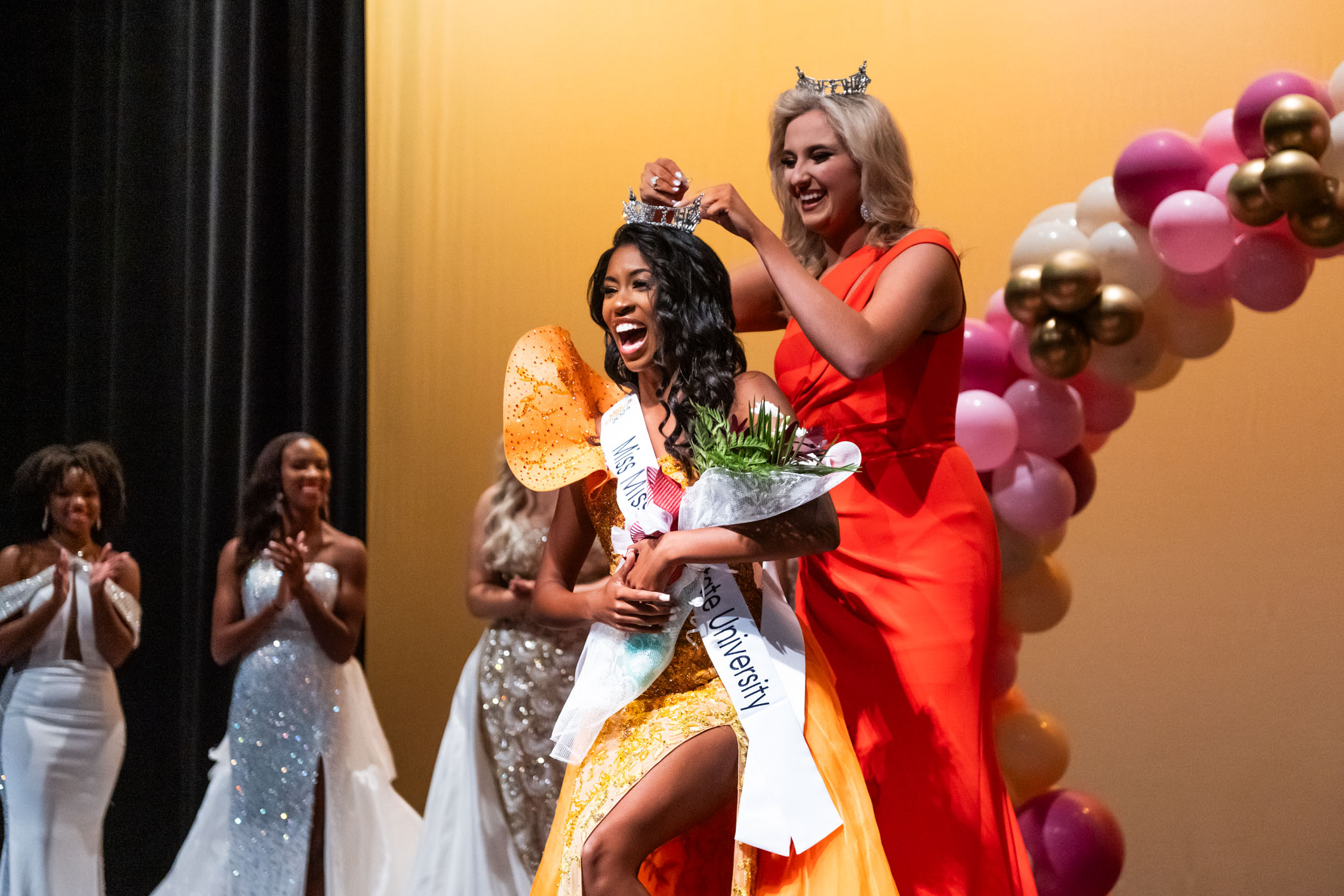 The winner is crowned on a beauty pageant stage