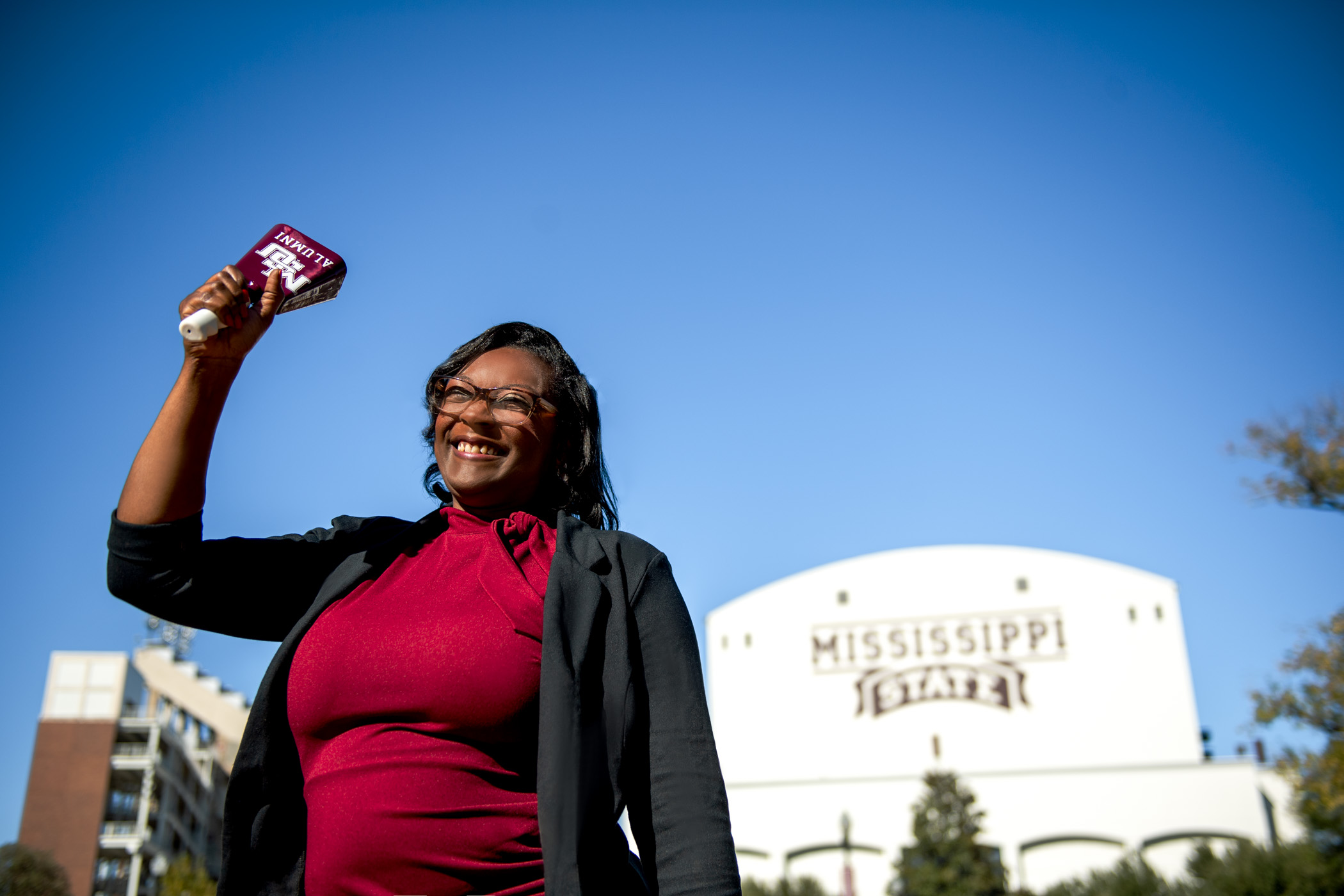 Fartilia Chandler, pictured ringing an MSU cowbell on campus