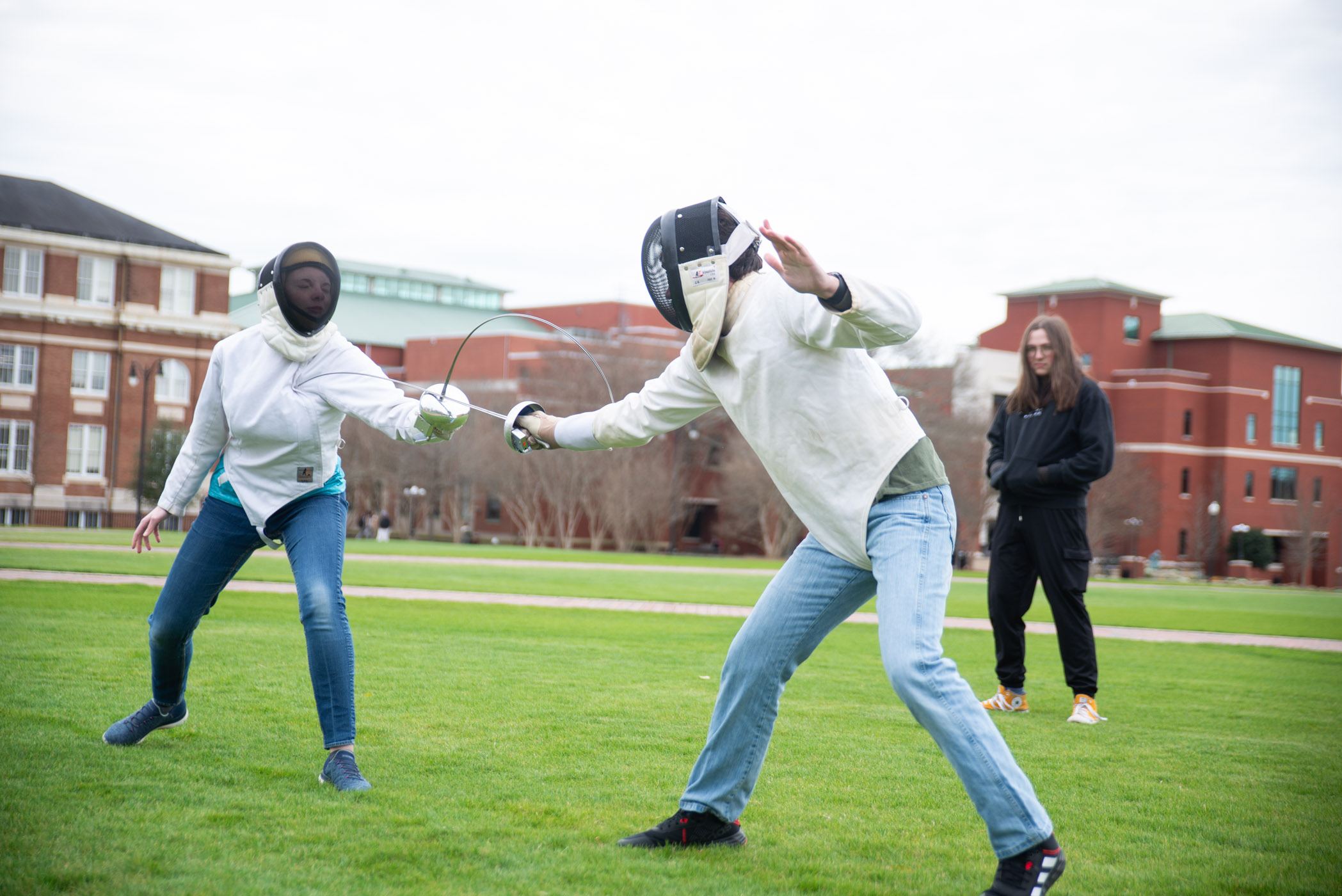 Members of the MSU Fencing Club take advantage of a spring day to practice their sport.