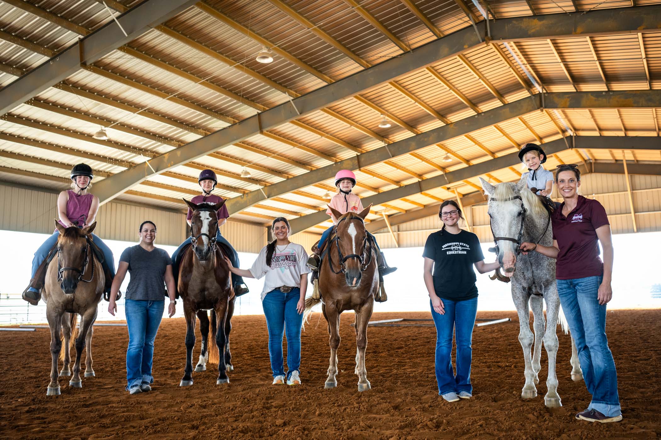 Participants in the Bridle Up Bulldogs Camp at Mississippi State University experience the joy of hands-on horseback riding, guided by the knowledgeable and enthusiastic members of MSU’s Equestrian Team. Hosted at the Horse Unit at the Henry H. Leveck Research Center, the camp offers young riders a welcoming environment to build confidence, develop horsemanship skills, and foster independence on horseback..