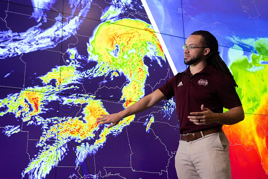 man in front of map