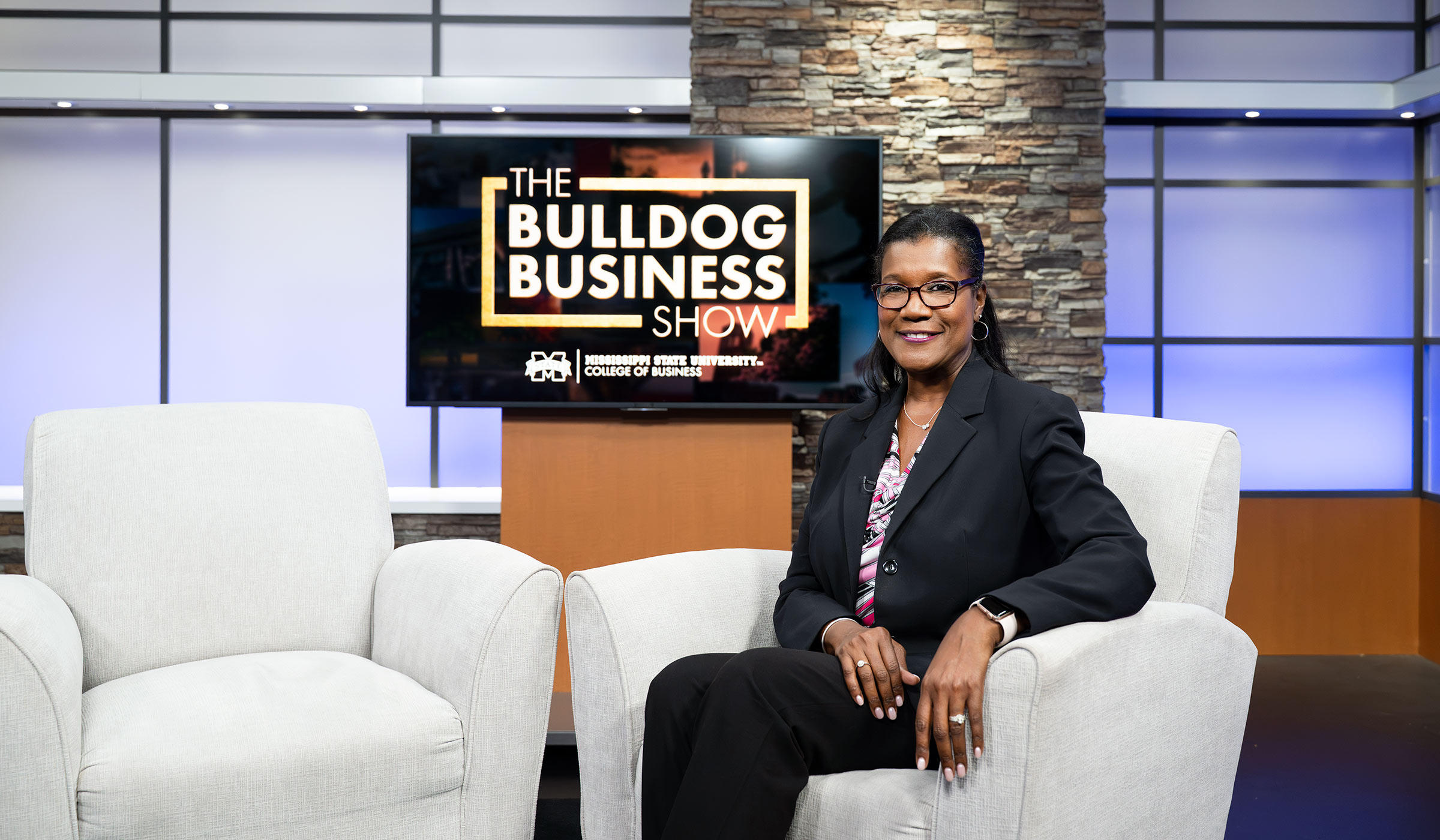 lady in chair in front of a screen