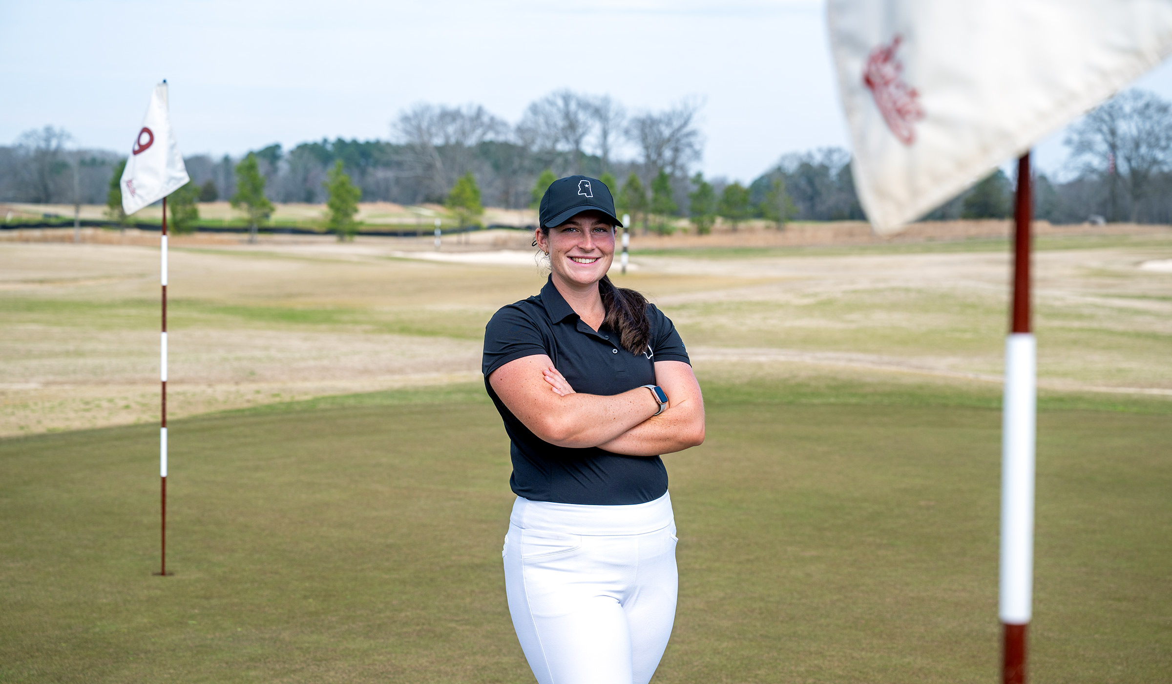 Avery Weed standing on a golf course