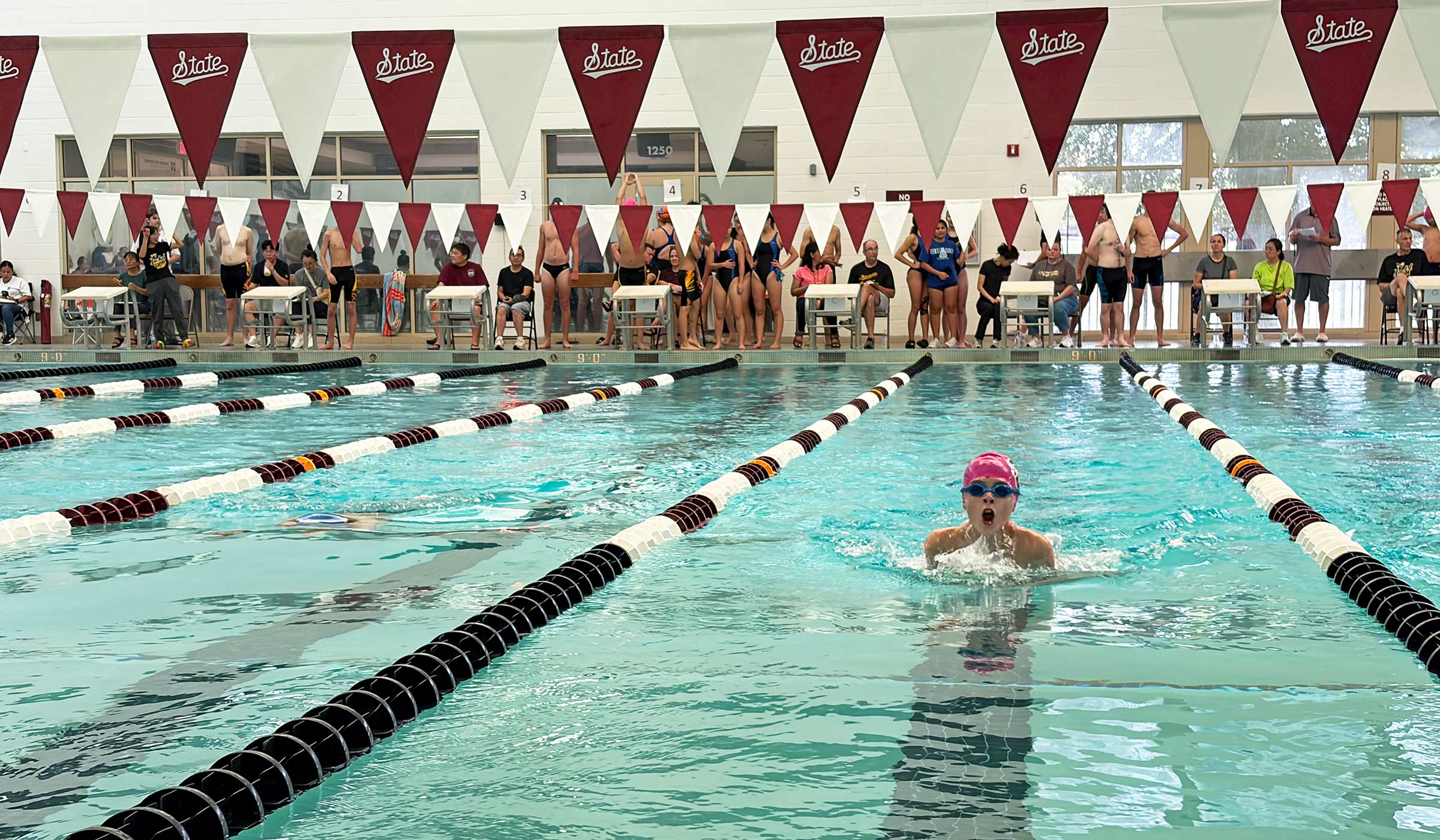Local middle school students compete in a swim meet at MSU's Sanderson Center.