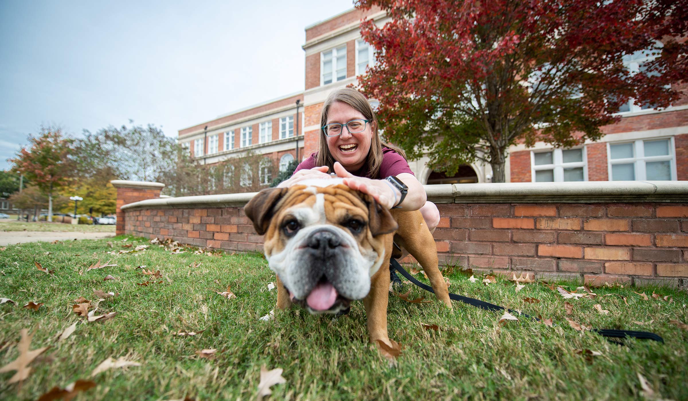 Beth Wynn and Jak the Bulldog on the Drill Field. 