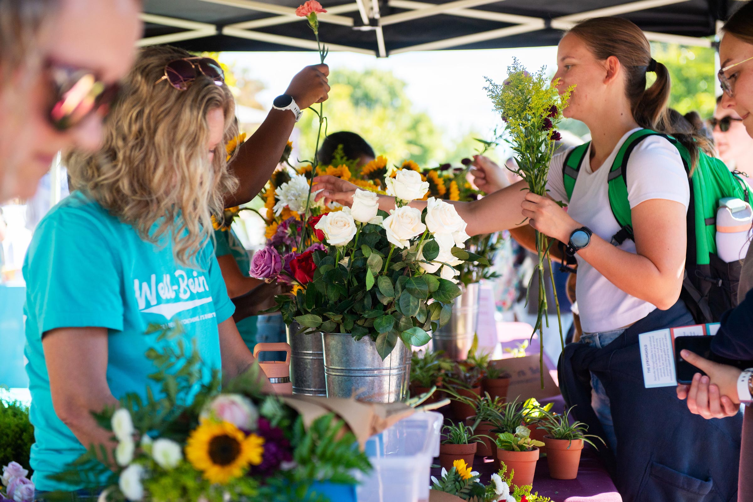 Students receive flowers, produce and plants during Mississippi State University’s Fuel and Flourish market Wednesday morning [Oct 21] along YMCA Plaza. Hosted by MSU's Office for Student Well-Being, the event promotes health, nutrition and overall wellness through access to wellness resources and opportunities to learn about healthy habits