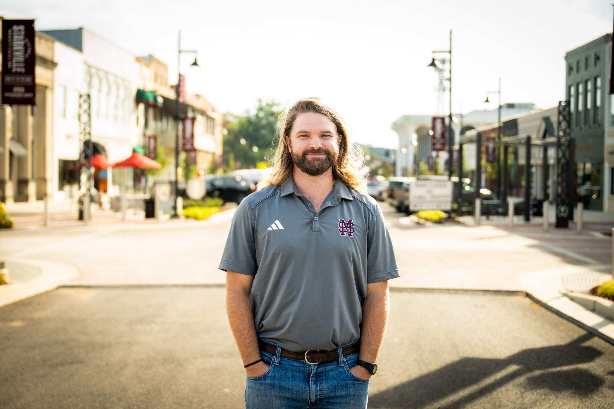 Mississippi State graduate student Stephen Kachelman poses on Main Street in Starkville.