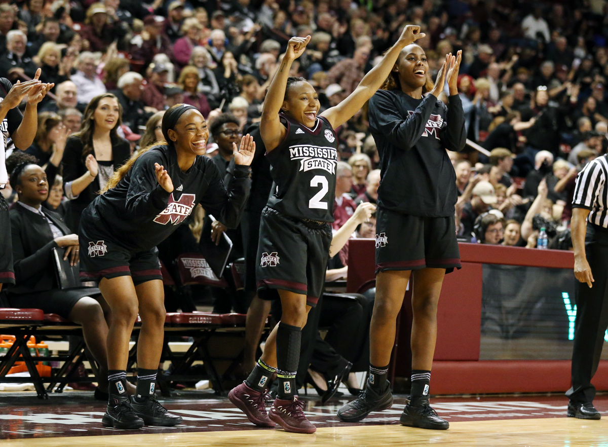 Women&amp;#039;s Basketball players cheer on their teammates during game against Ole Miss.