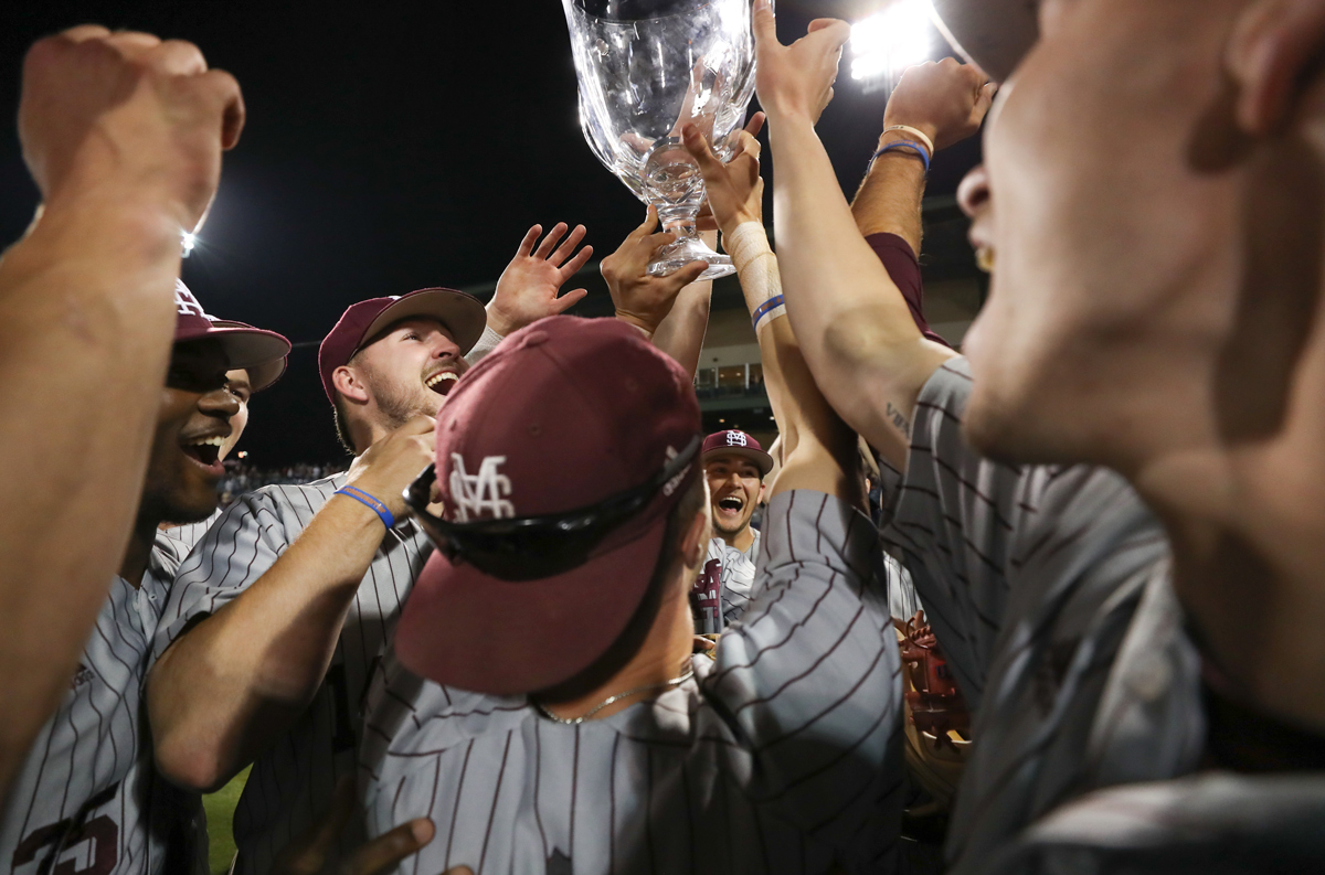 Tight shot of MSU Baseball players raising the Governer&amp;#039;s Cup in triumph after beating Ole Miss in Pearl.