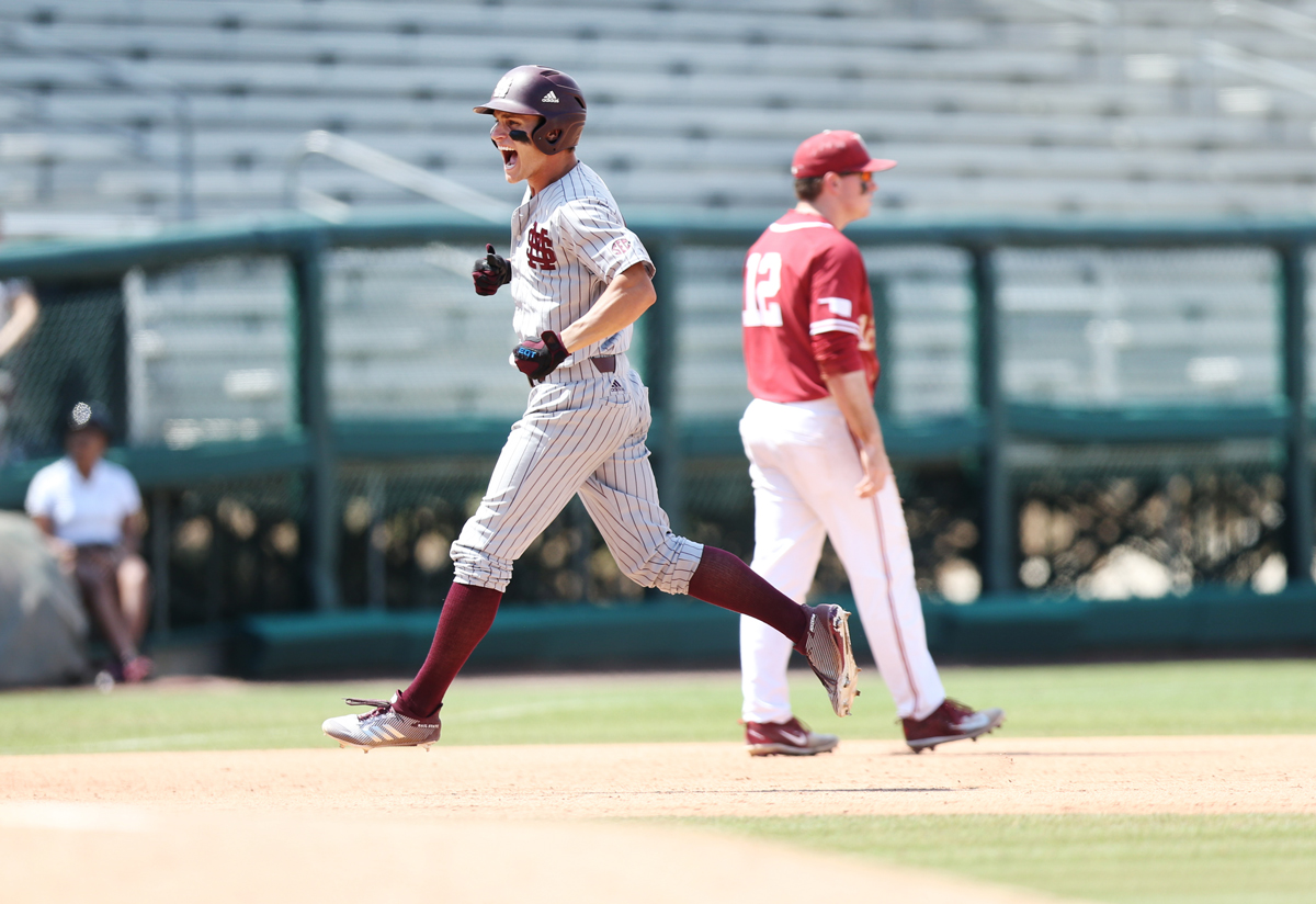 Mississippi State baseball player Jake Mangum appears to levitate with joy as he completes his home runduring the Bulldogs’ 8-1 