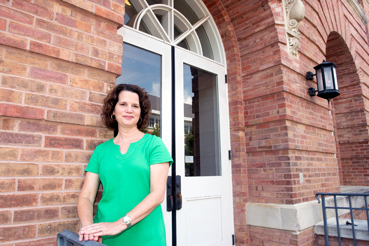 Julie Capella, pictured standing outside of Montgomery Hall.