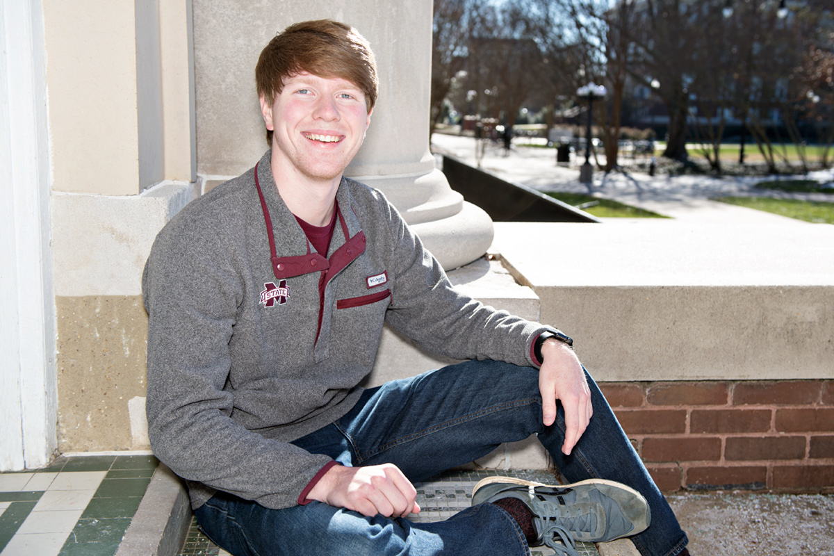 Jacob Easley, pictured sitting outside a building on MSU&amp;#039;s Drill Field.