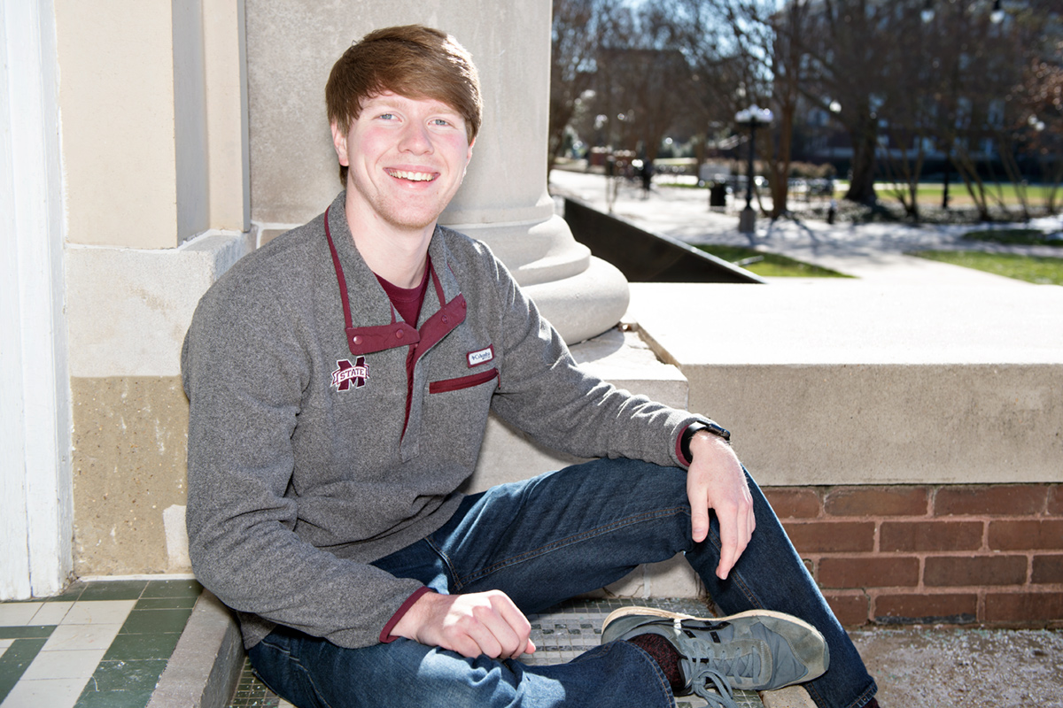 Jacob Easley, pictured sitting outside a building on MSU's Drill Field.
