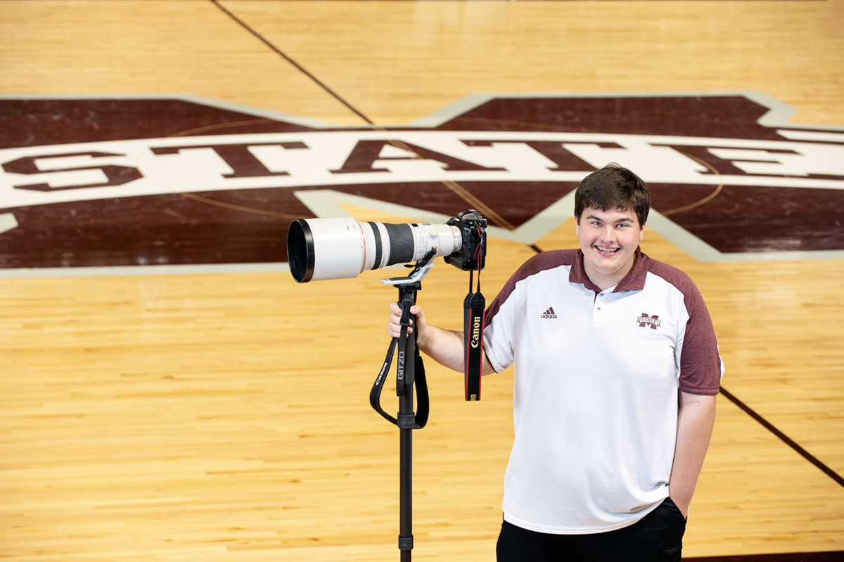 Blake Williams, pictured with his camera on the floor of Humphrey Coliseum