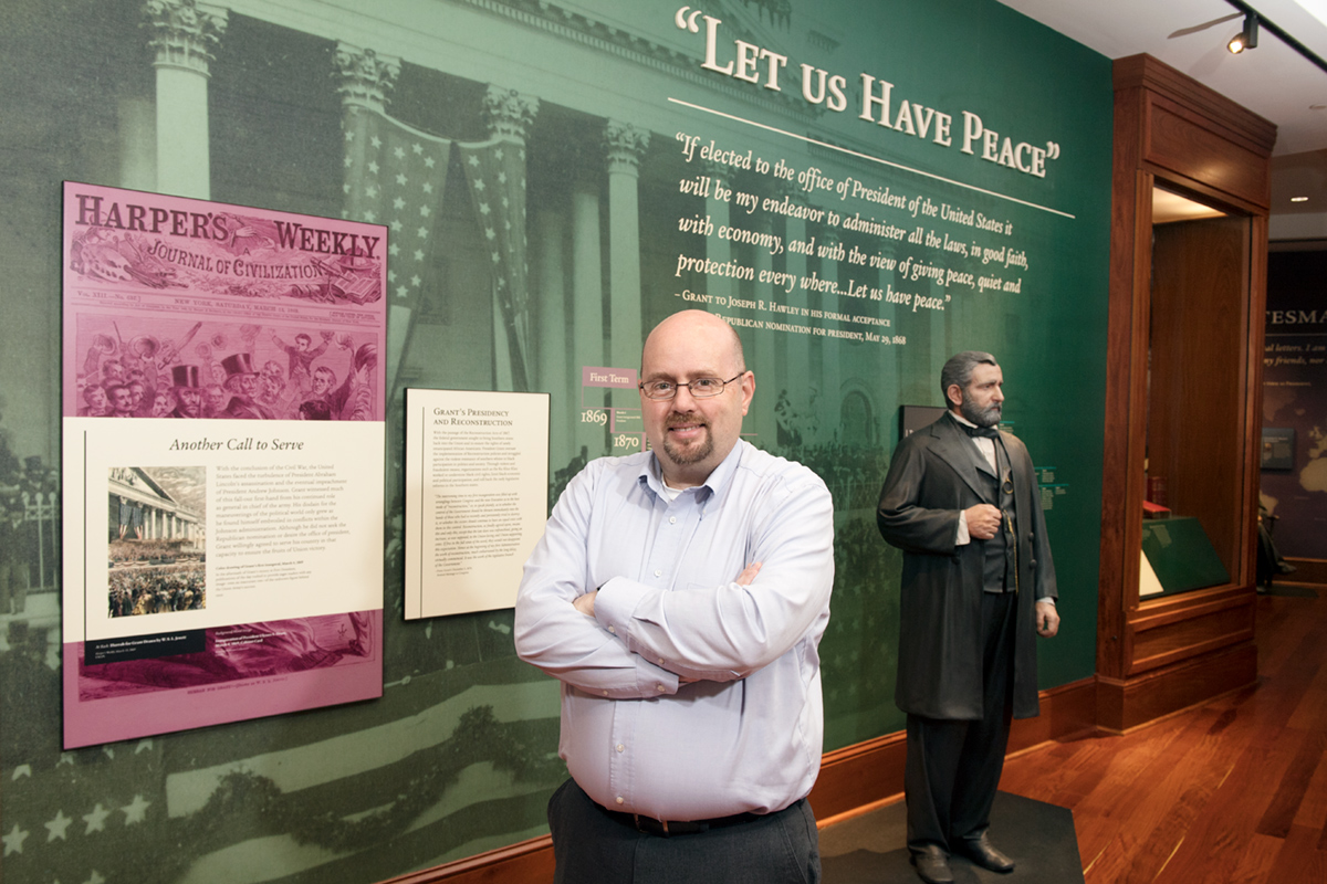 Ryan Semmes, pictured in front of one of the Ulysses S. Grant statues in Mitchell Memorial Library.
