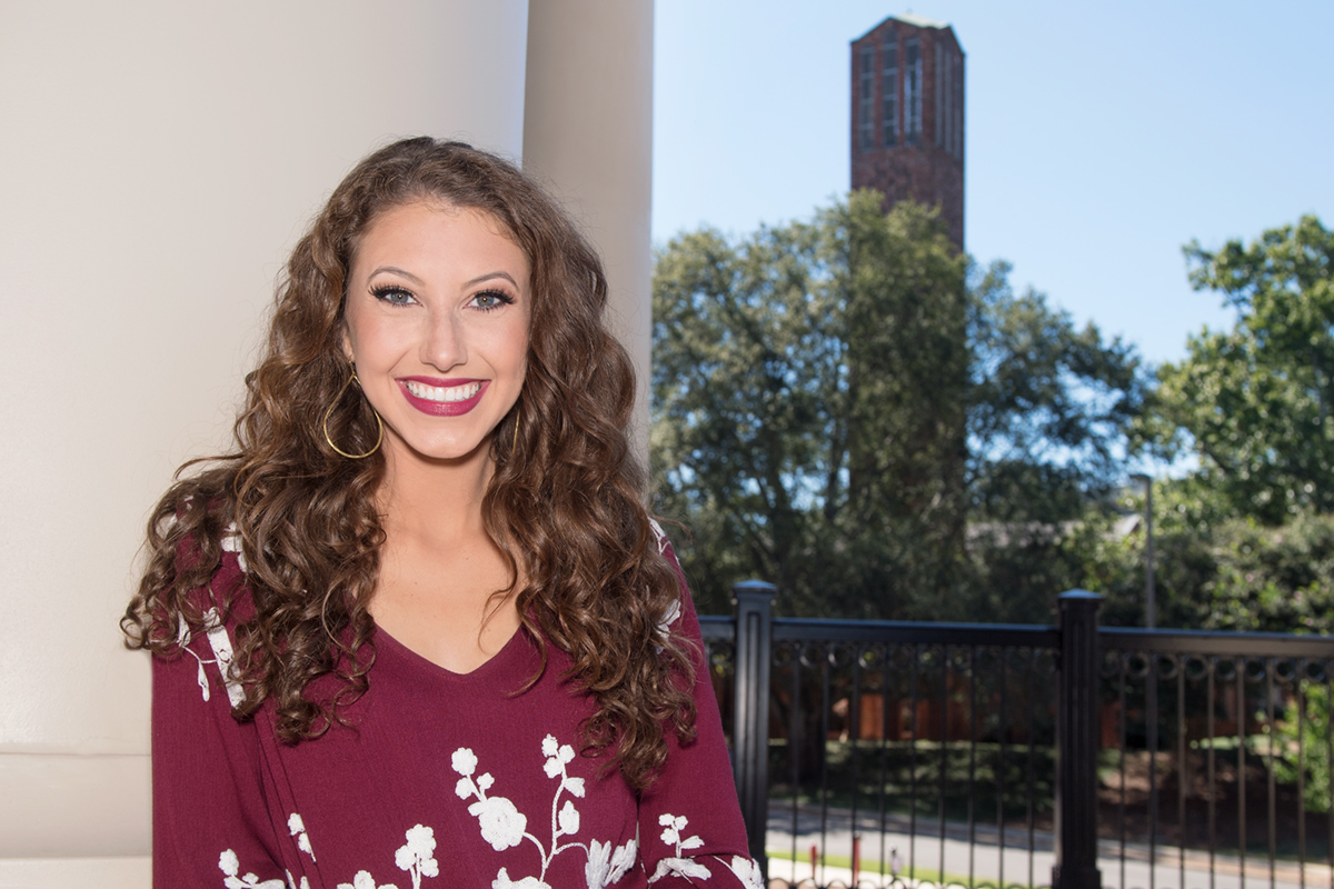 Hannah Duke, pictured at MSU&amp;#039;s Old Main Academic Center with the Chapel of Memories carillon tower in the distance