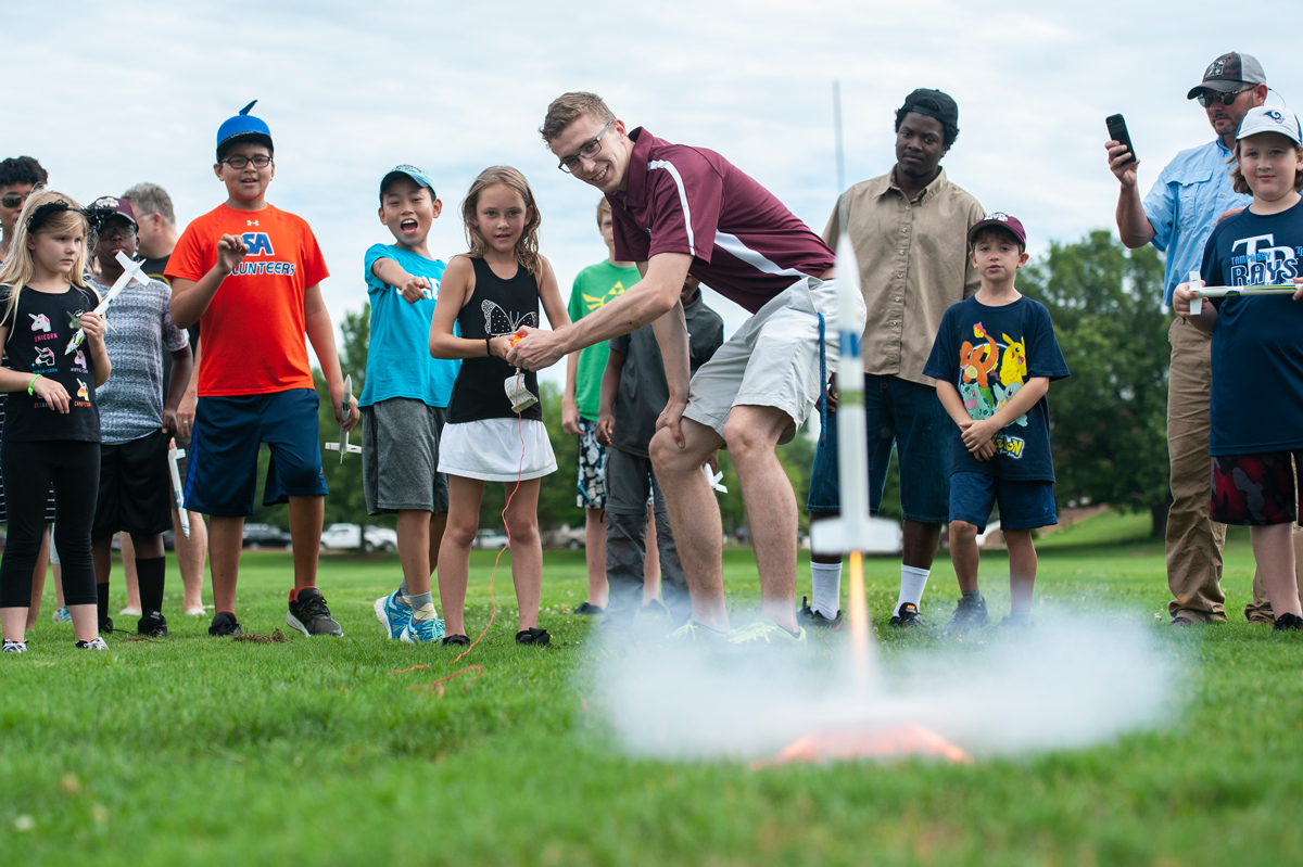 MSU Space Cowboy demonstrates a rocket launch for YES campers as one rocket takes flight.