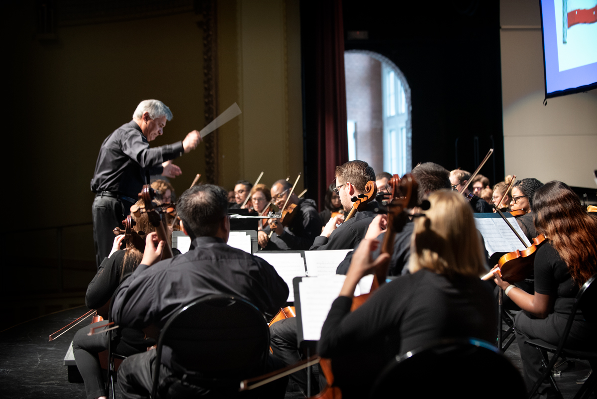 Symphony Music Director Barry Kopetz conducts the musicians on the Bettersworth Auditorium stage.