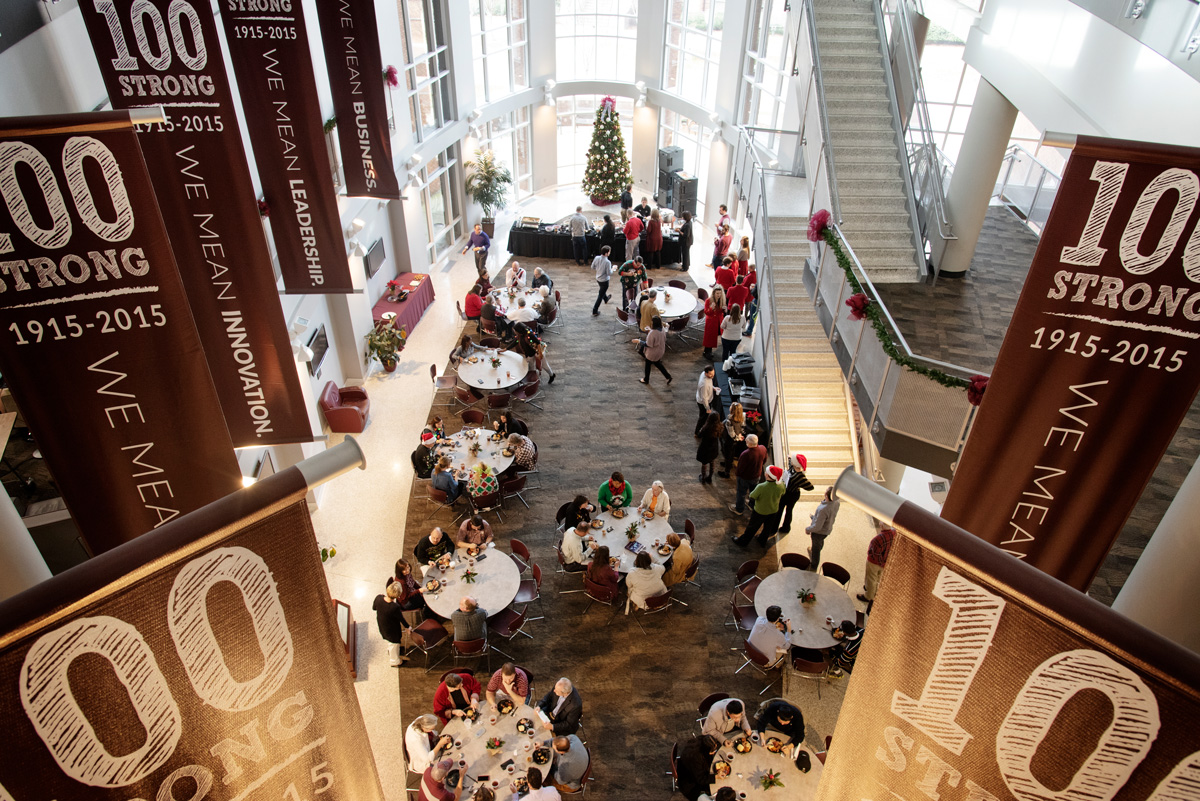 With banquet tables and a Christmas tree, McCool&amp;#039;s atrium is viewed from above and framed with 100 Year banners.