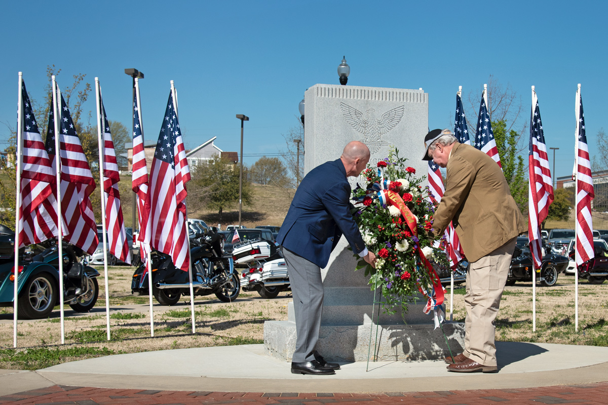 Center for America&amp;#039;s Veterans Director Brian Locke and Judge Boykin lay a wreath at MSU&amp;#039;s Vietnam War Memorial. 