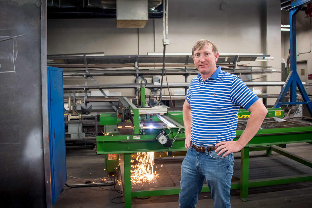 Wes Lowe stands in the Mississippi Agricultural and Forestry Experiment Station&amp;#039;s machine shop.