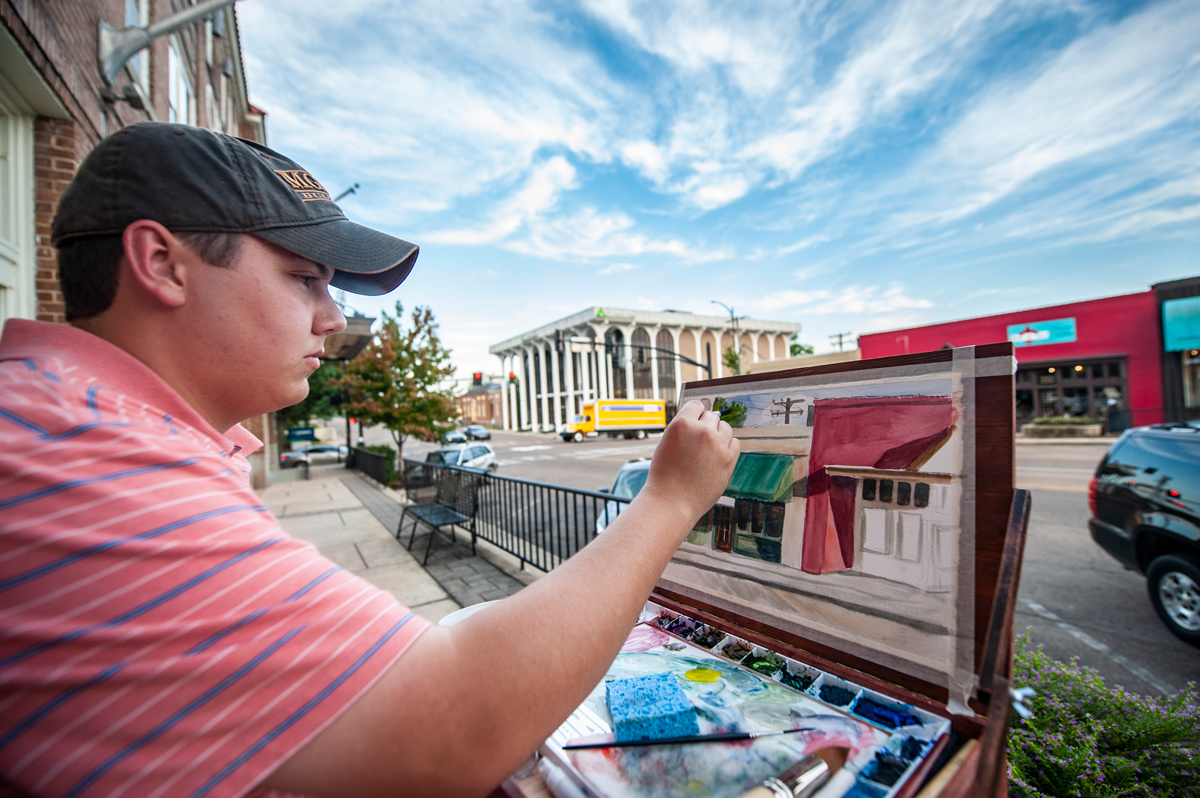 MSU Art Student Garrett Seal paints the scenes of Starkville&amp;#039;s Main Street during his off time this summer.