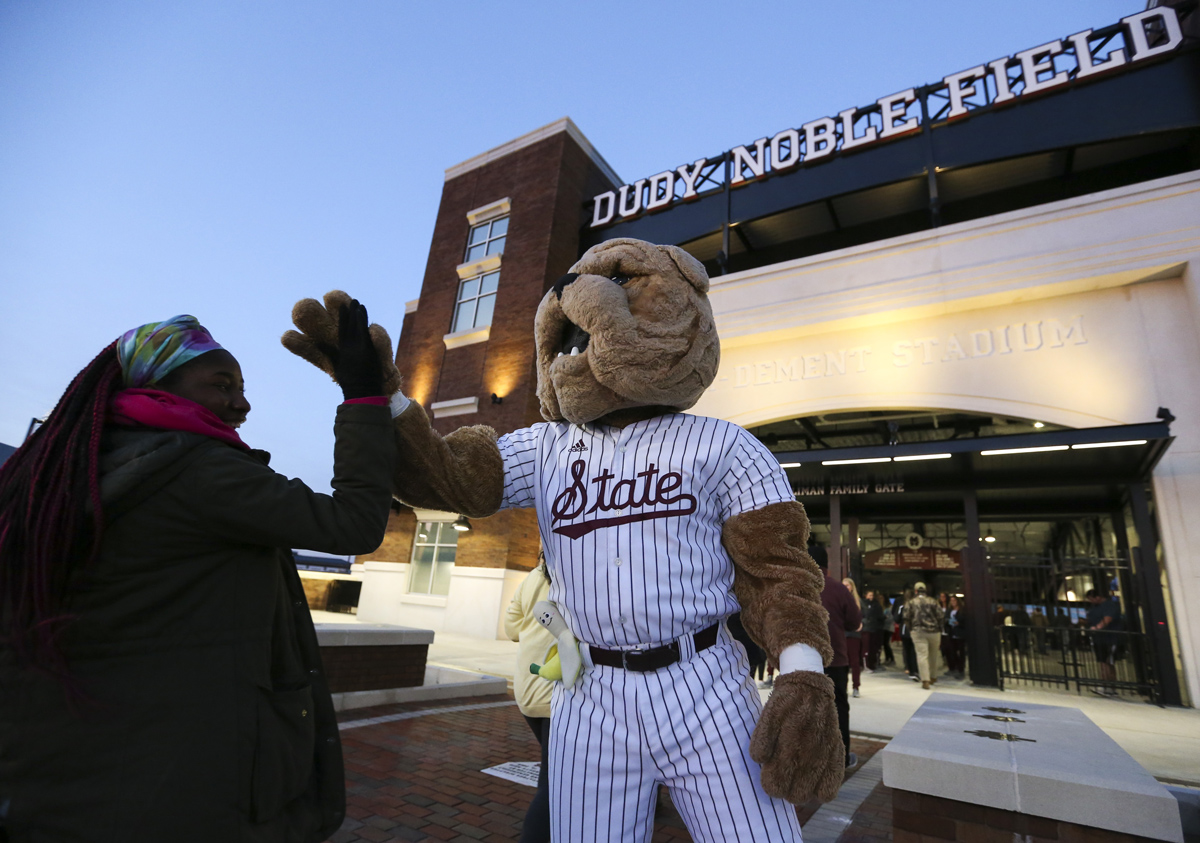 Bully greets a student outside the new Dude baseball Stadium before Cowbell Yell.